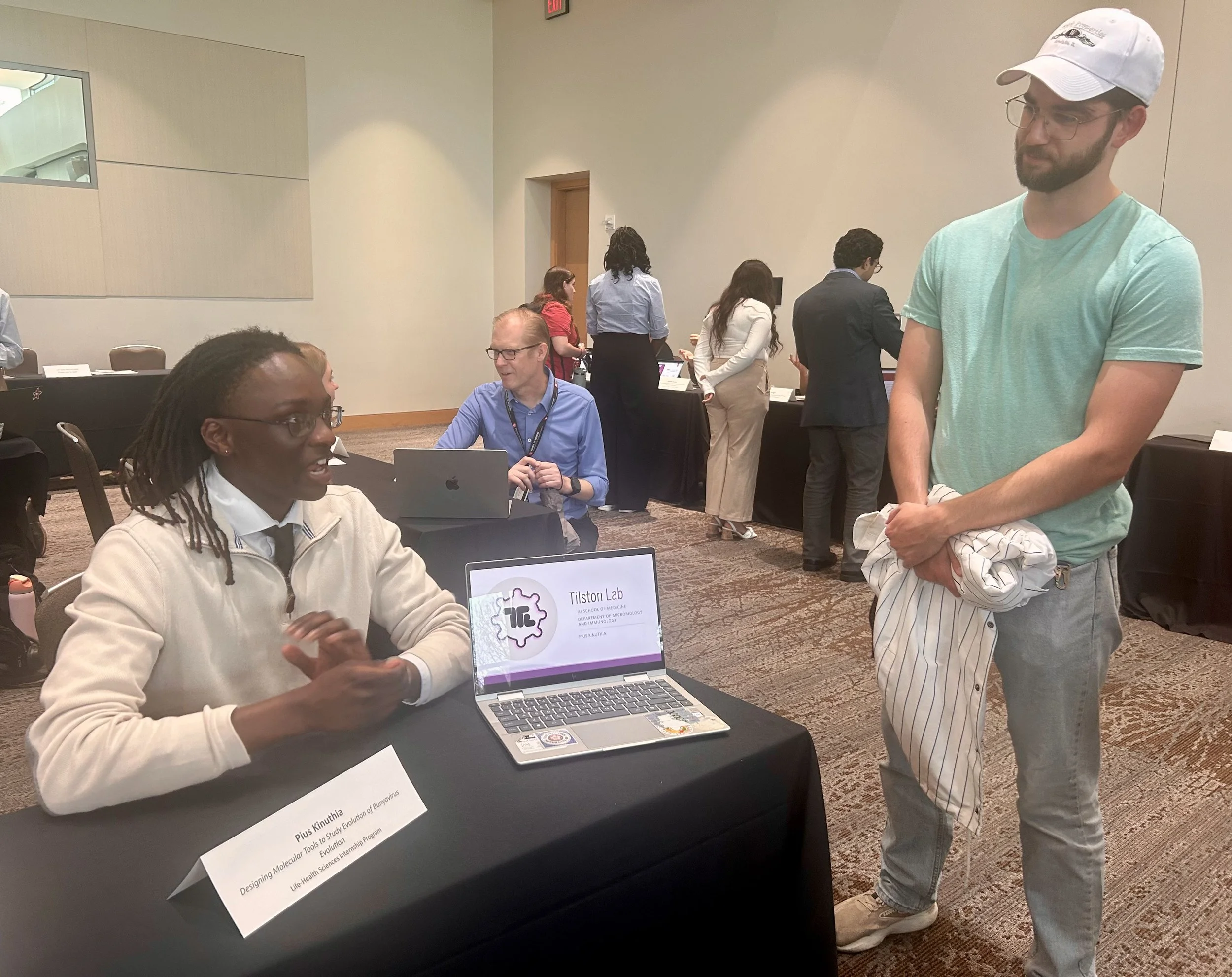 Pius presenting his LHSI (Life-Health Sciences Internship Program) Showcase Project. James looking on as his proud mentor :)