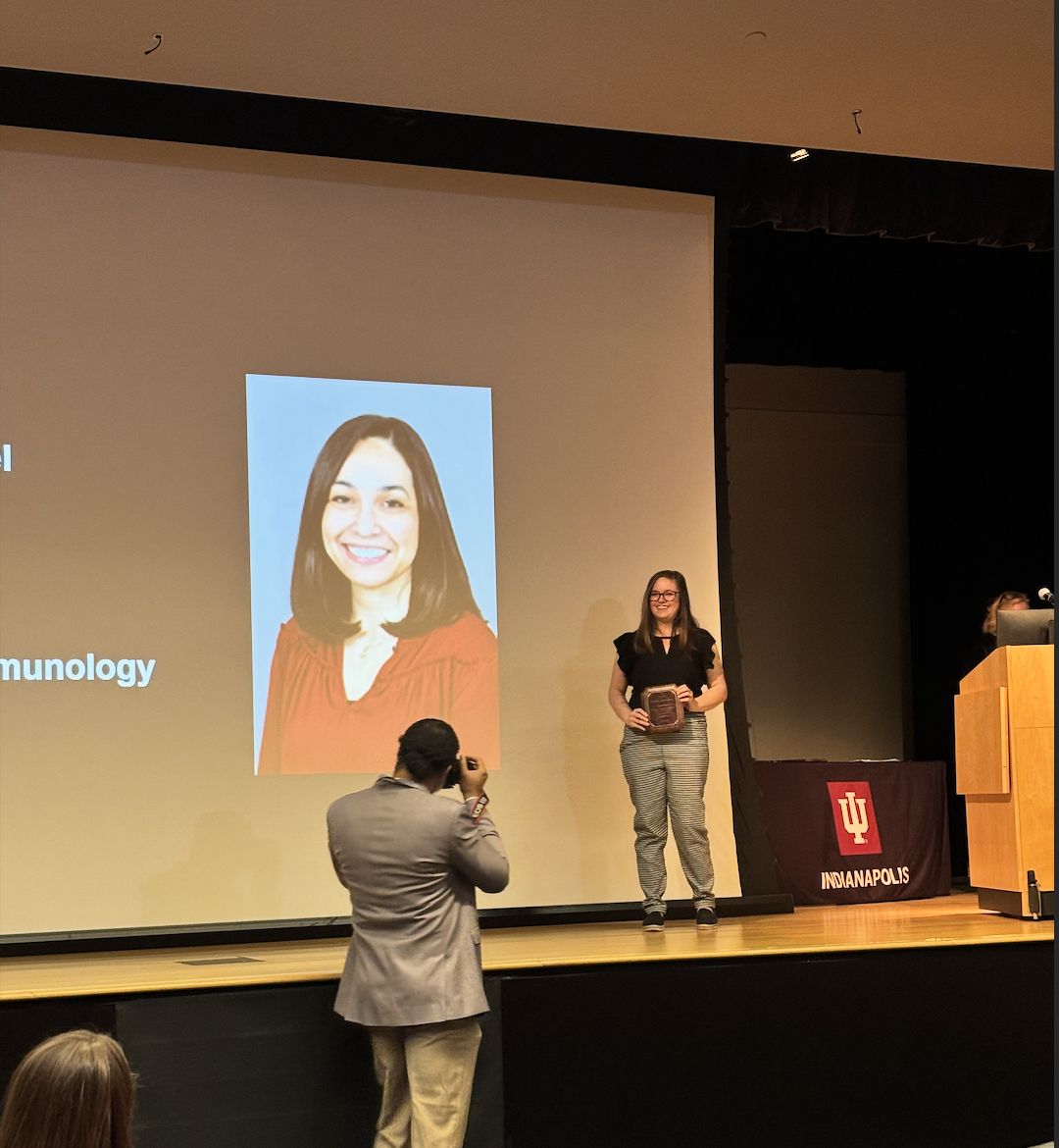 Krista's accepting a prize on behalf of NLT (Women's History Month recognition award) ' 25