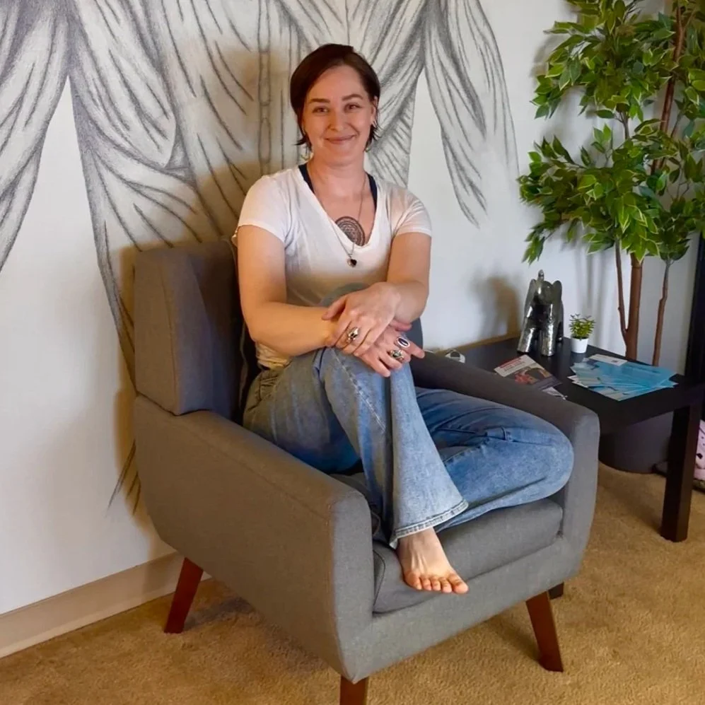 Licensed Prenatal Massage Therapist Haley Bangert giving a massage in at Summit Therapeutics in Greenwood Village, Colorado