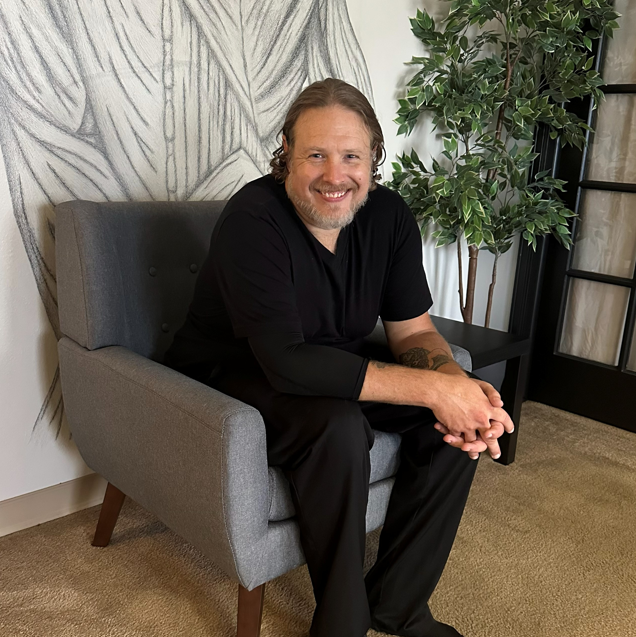 Licensed Deep Tissue Massage Therapist James Scott, giving a pain relief massage at Summit Therapeutics in Greenwood Village, Colorado