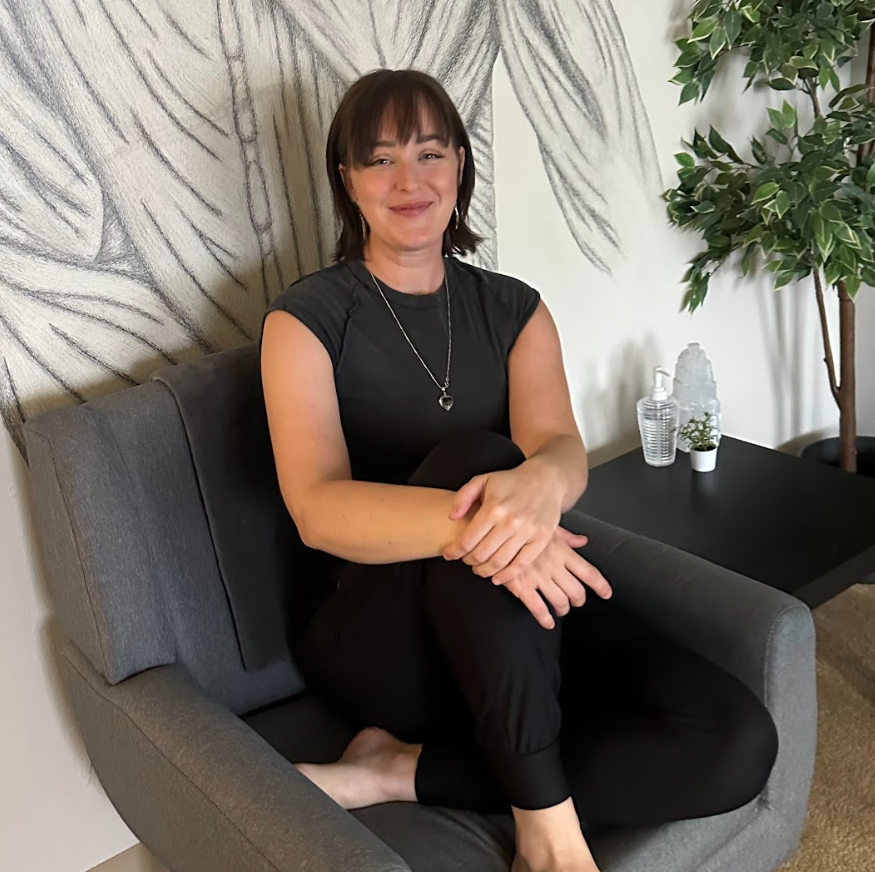 Licensed Prenatal Massage Therapist Haley Bangert giving a massage in at Summit Therapeutics in Greenwood Village, Colorado