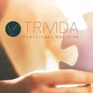 Logo for Trivida Functional Medicine with a dark circle and stylized lines, and the words 'TRIVIDA FUNCTIONAL MEDICINE' on a light gray background.
