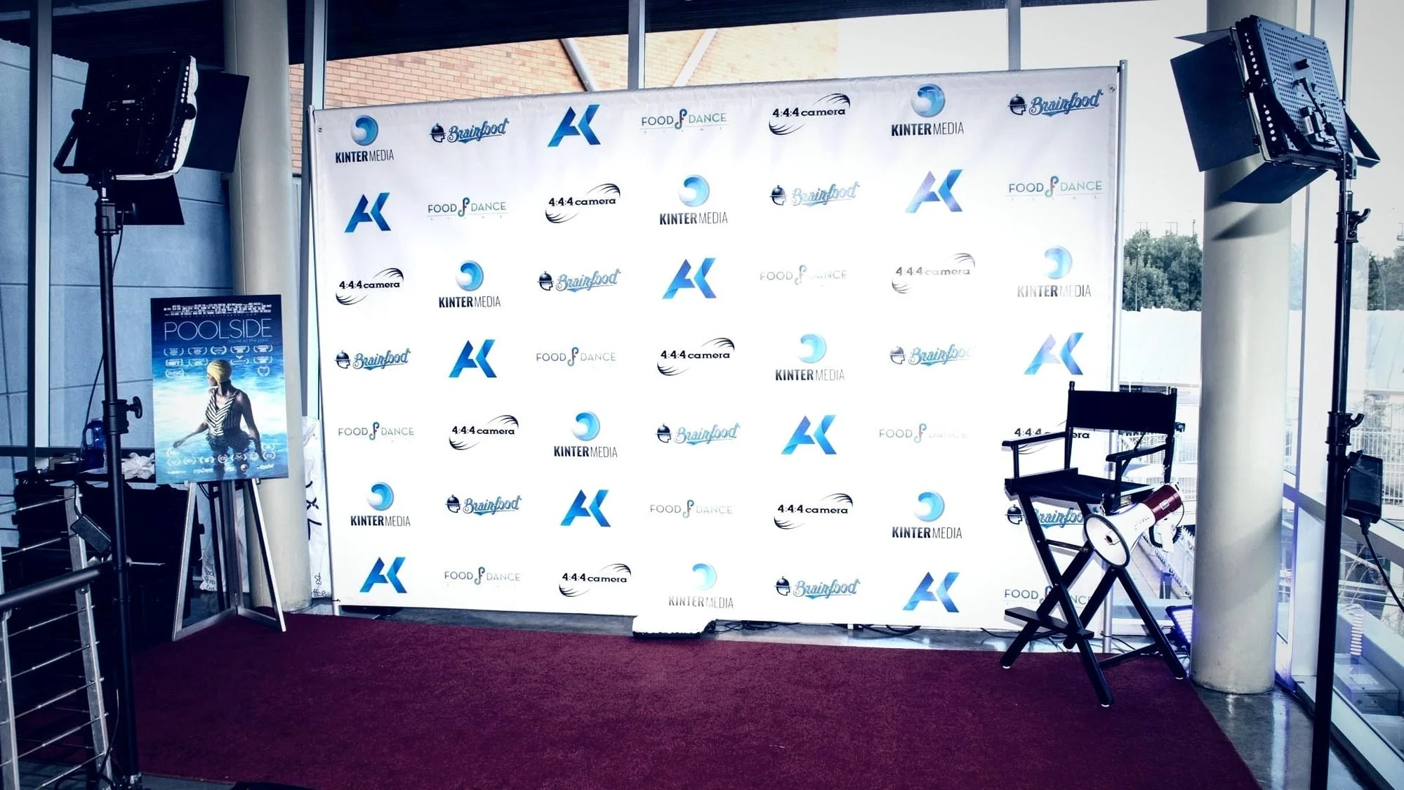 Red carpet step-and-repeat lit for a Dallas gala, filmed by event videographer Alex Kinter