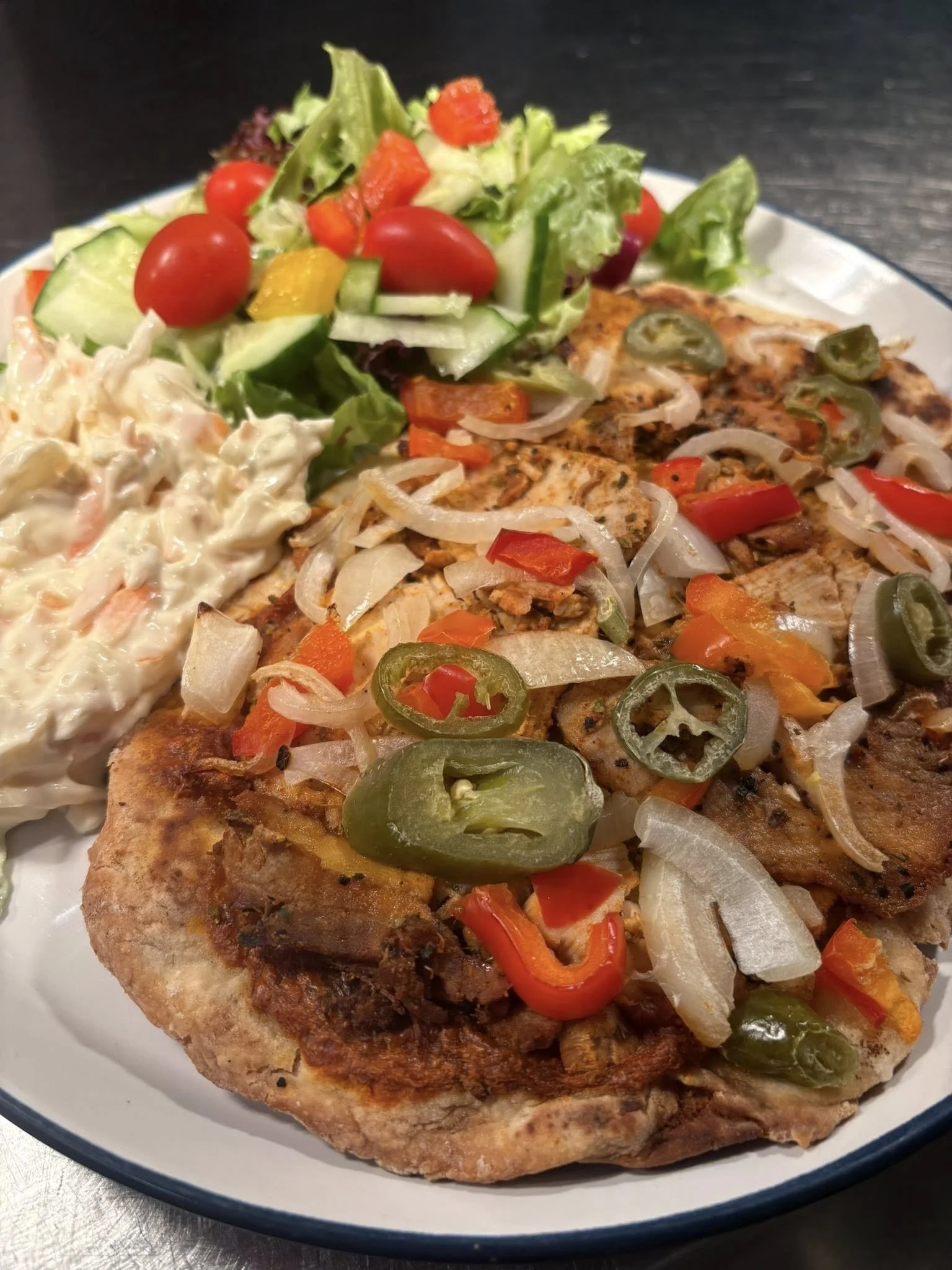 Homemade Flatbread with Herb Pork and Jalapenos served with Salad and Coleslaw