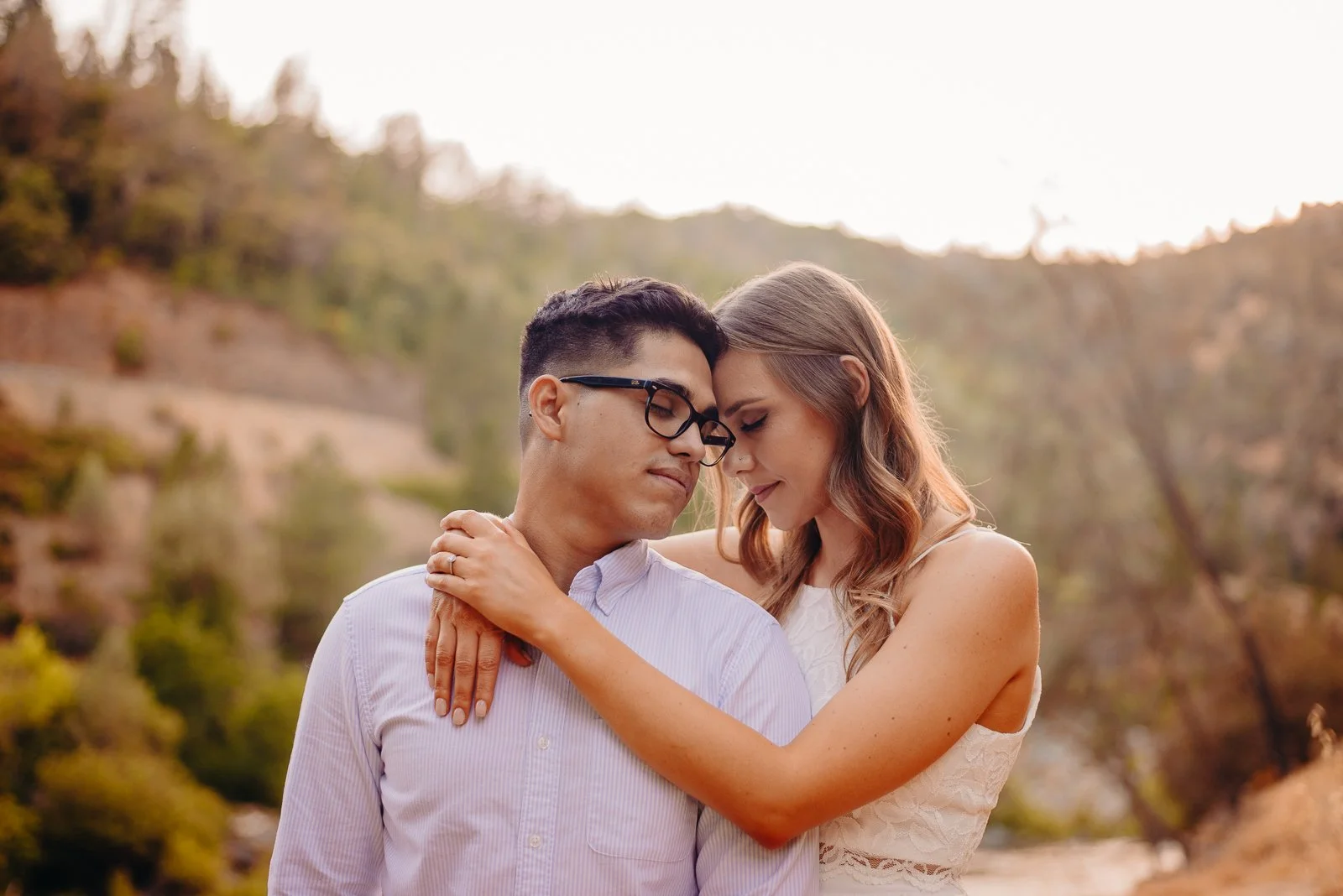 Couple leaning on each other intimately during engagement photos
