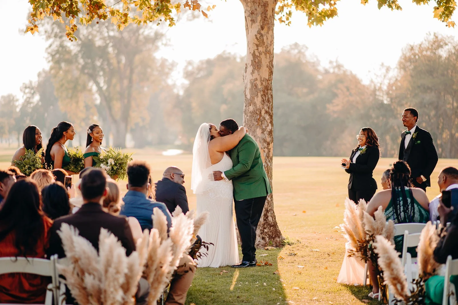 Bride and groom kissing during wedding ceremony