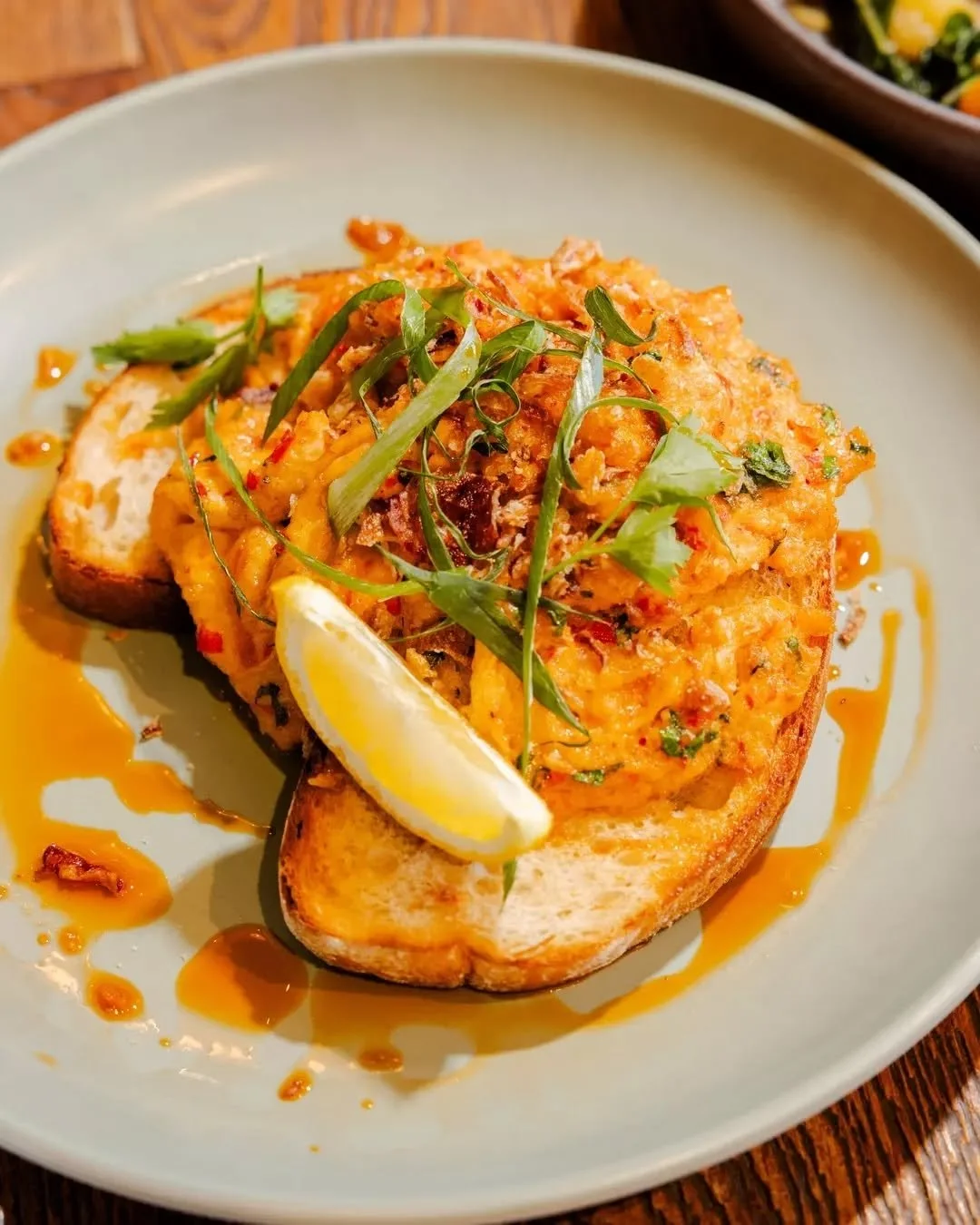 Brunch with a little bite. Our chilli crab scramble brings the heat. 🌶️