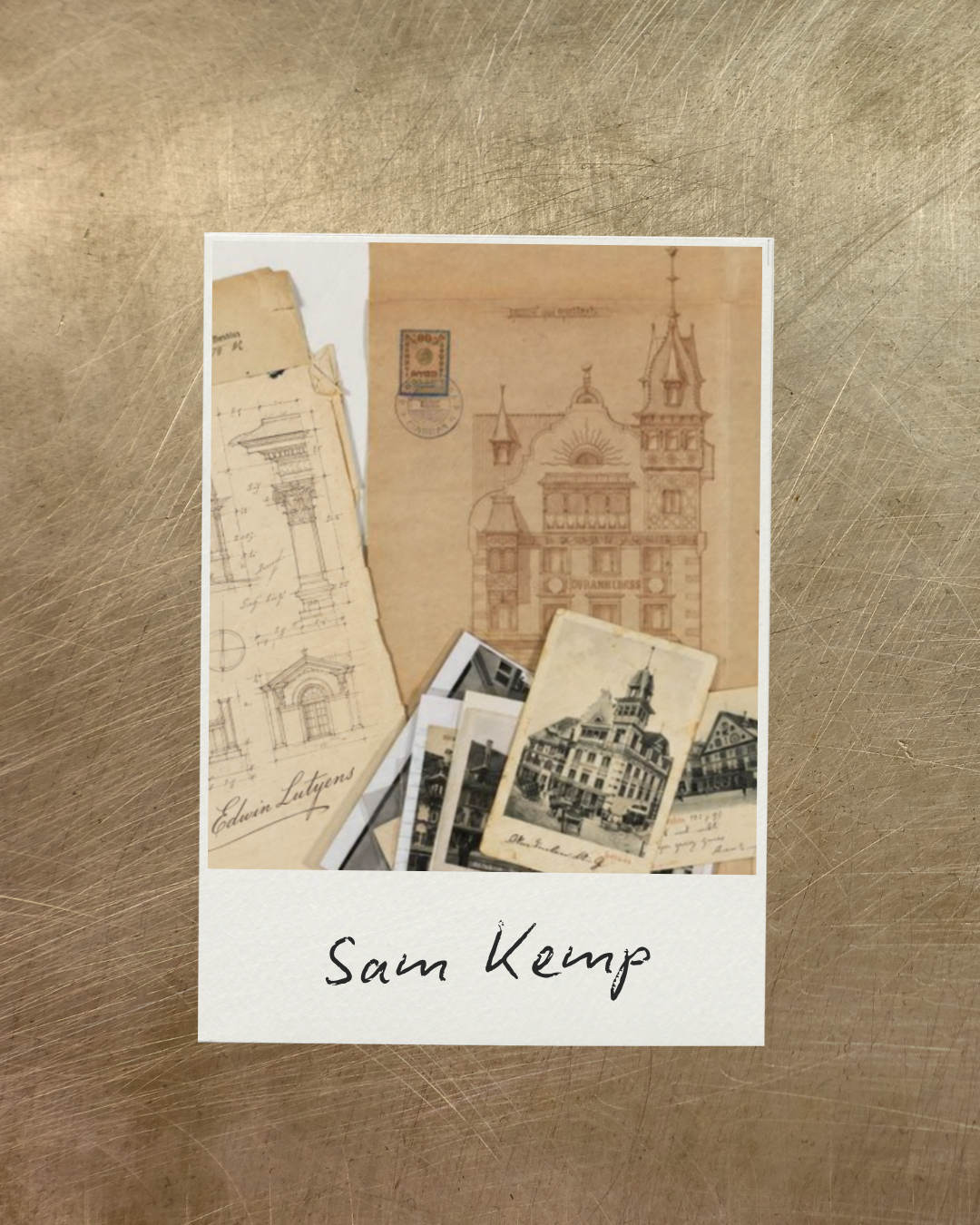 A collection of vintage architectural drawings, postcards, and photographs on a textured surface. The items feature sketches of building facades, a detailed drawing of an architectural column, and images of cityscapes. The photo has a label at the bottom that says "Sam Kemp."