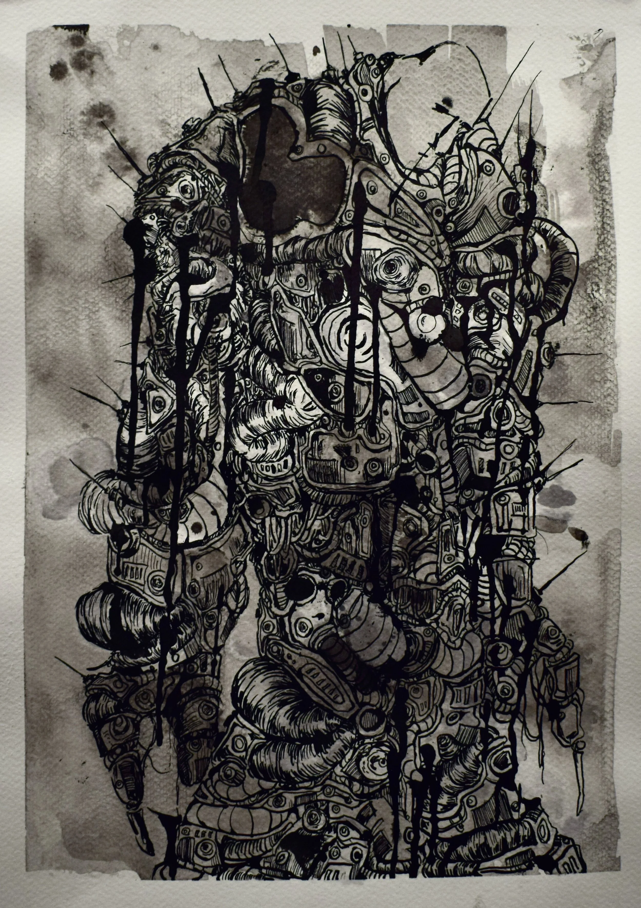 Black ink drawing on paper depicting a humanoid figure made of mechanical and organic parts, with dripping ink and watercolor splatters in the background.