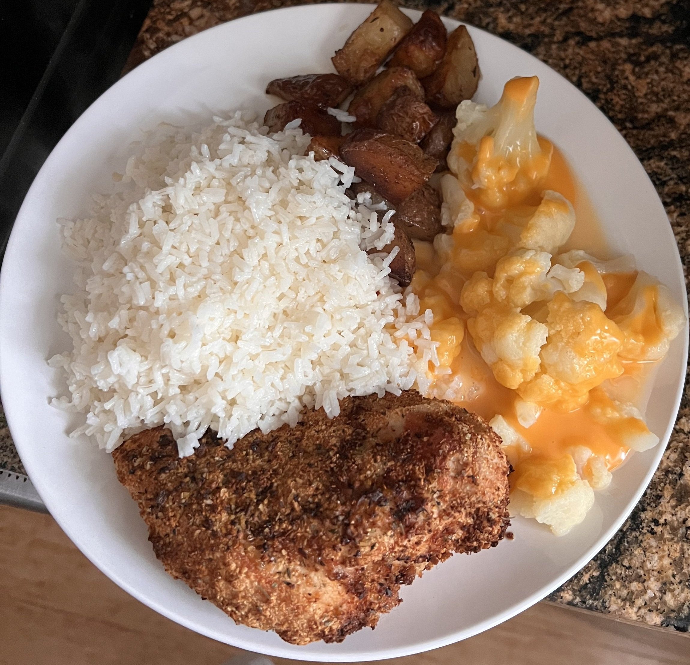 Cauliflower, Breaded Chicken Breast with White Rice and Roasted Potatoes