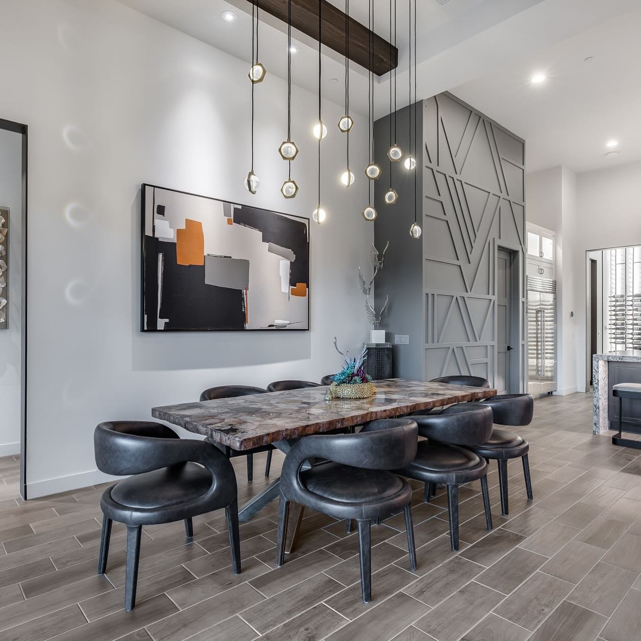 There are so many amazing features to this dining room but I think the one of a kind art piece is the star of the show and really warms up the space.