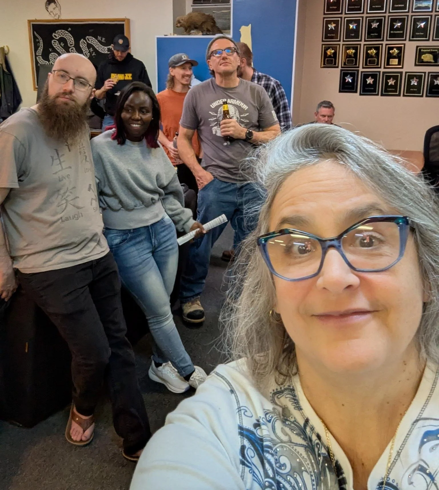 Chris Lopez (FSP Welcome and Engagement Director) snaps a shot at the Quill's April New Mover Potluck in Manchester where dozens of Free Staters celebrated and welcomed three new movers and one visitor to the state.