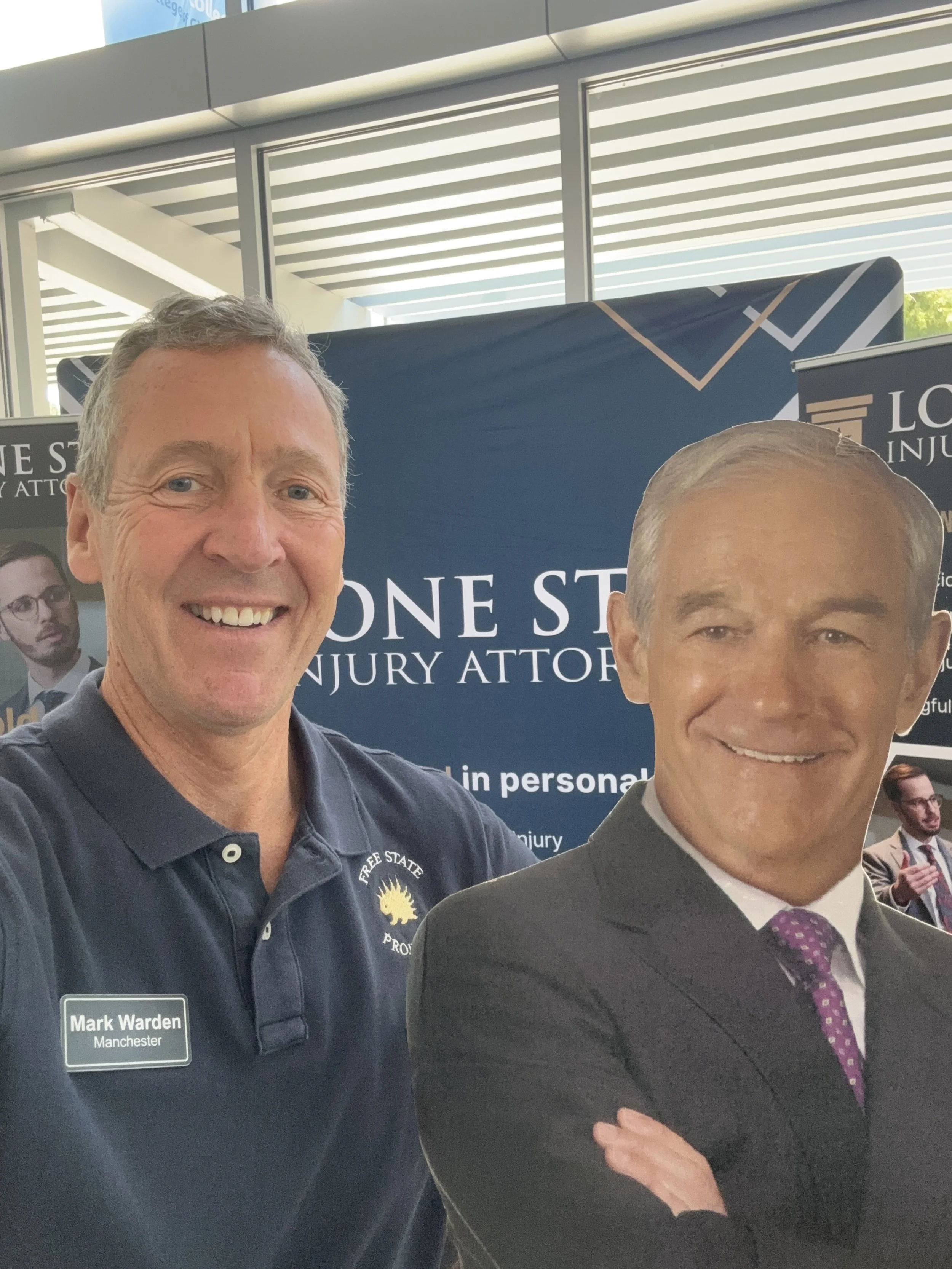    Not Quite the Real Thing.    Rep. Mark Warden grabs a photo with a cardboard cutout of our favorite retired Texas Congressman.  