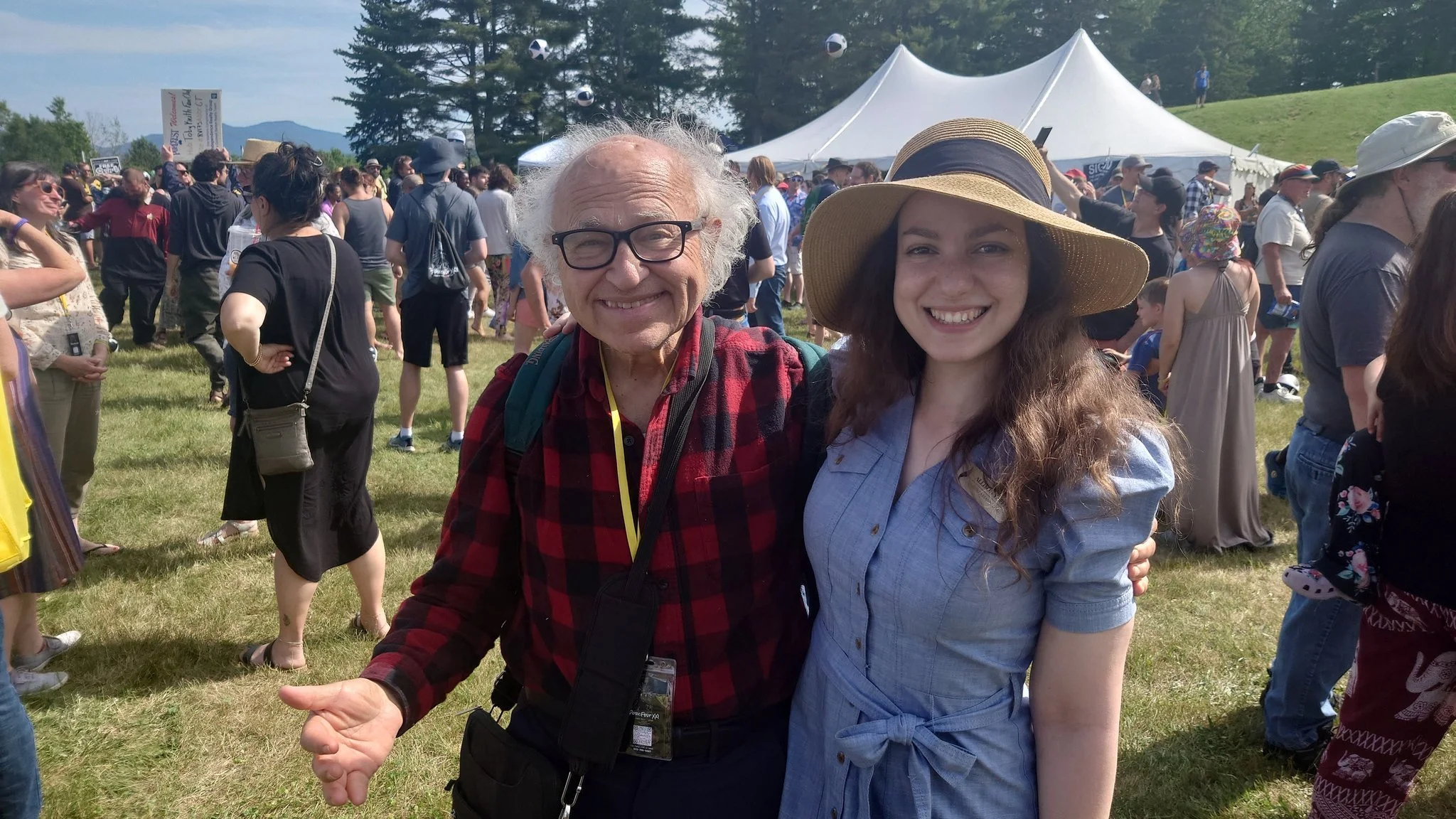 Pictured: David Friedman and Allison Yaffee (Research Associate with Libertarianism.org ) on the final day of PorcFest XXII, as all gather on the field for the annual group photo featured above.