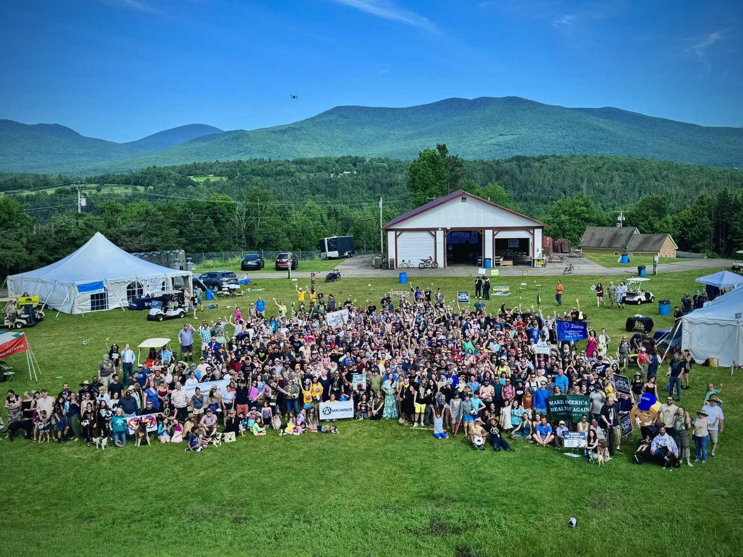 The PorcFest XXII community gathered for a group photo outdoors.