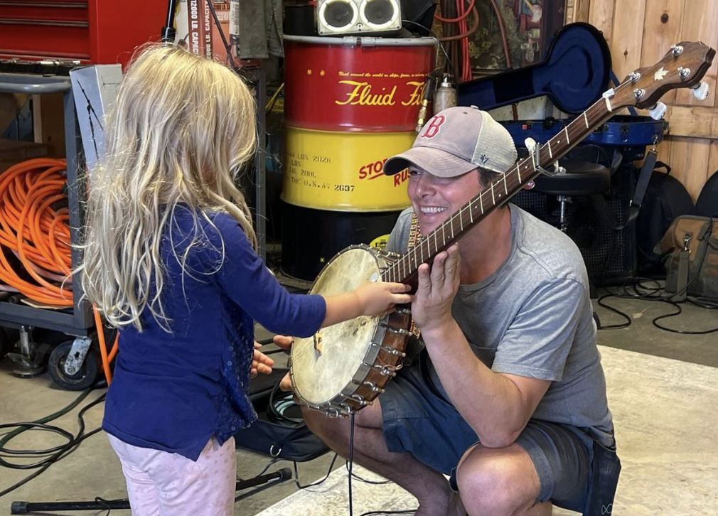 Freedom Palooza 2025 at Roaring Brook Farm. At five years old, one of the youngest attendees of Freedom Fest meets one of the musicians.