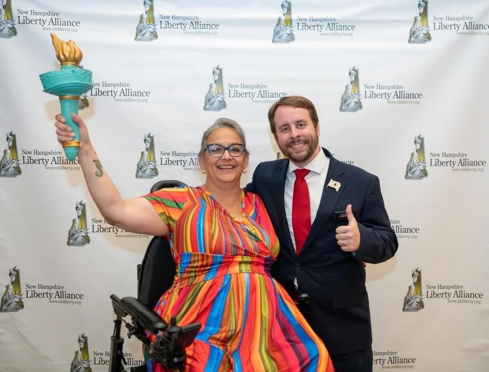 NHLA Liberty Dinner. At last year's NHLA Liberty Dinner, Eric Brakey (FSP Executive Director) and Chris Lopez (FSP Welcome and Engagement Director) snap a photo together with the torch of liberty. Grab your tickets for this year's dinner .
