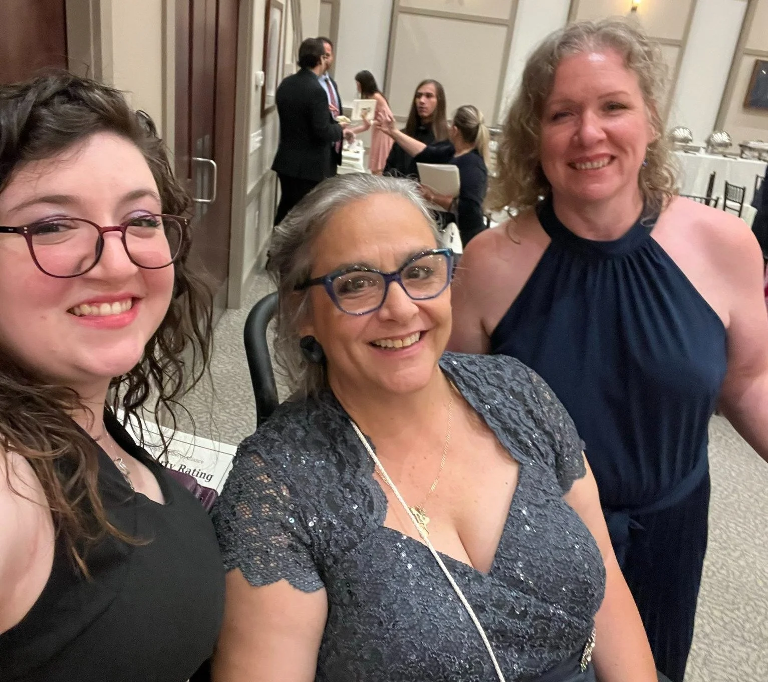 Friends at Liberty Dinner! Free state leaders — Miranda (Design Strategist), Chris (Welcome and Engagement Director), and Constance (PorcFest 2024 Lead Producer) snap a selfie at the 2025 NHLA Liberty Dinner.