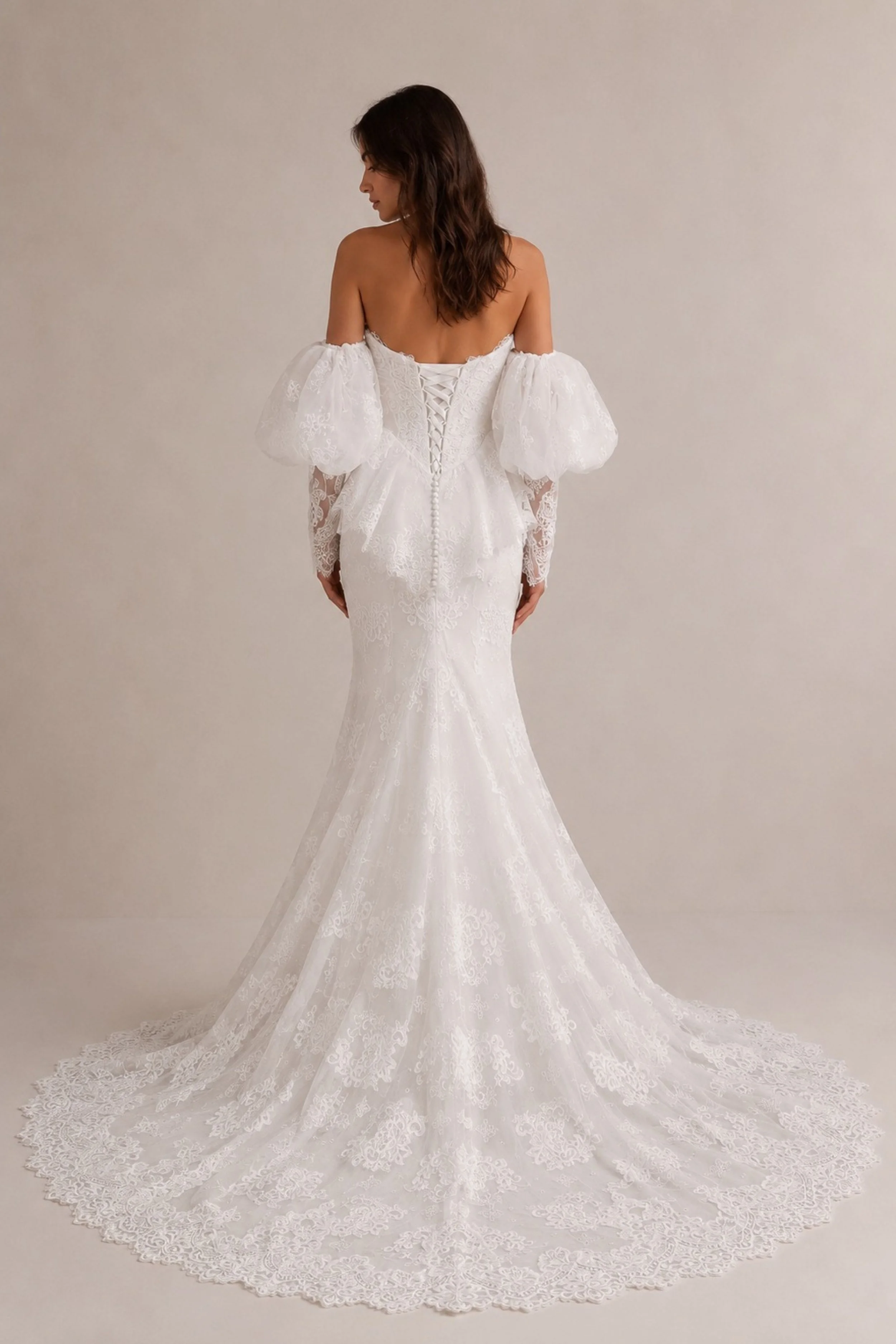 Vintage Chantilly lace wedding dress with sweetheart neckline, puff sleeves, fitted mermaid silhouette and scalloped train for a modern bride.