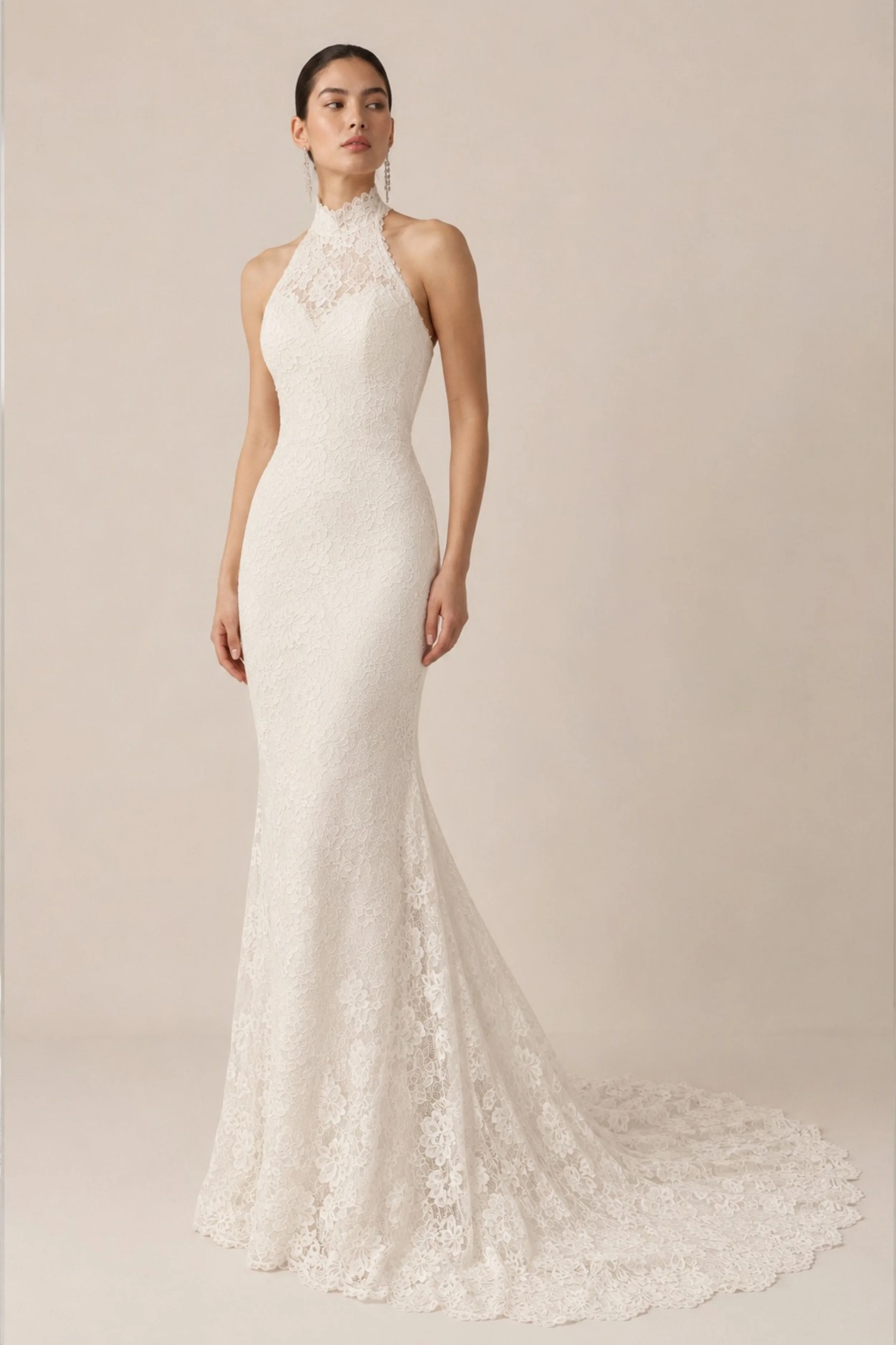 High neck halter lace wedding dress with a fitted sheath silhouette, floral Chantilly lace, open shoulders, and a delicate cathedral train.