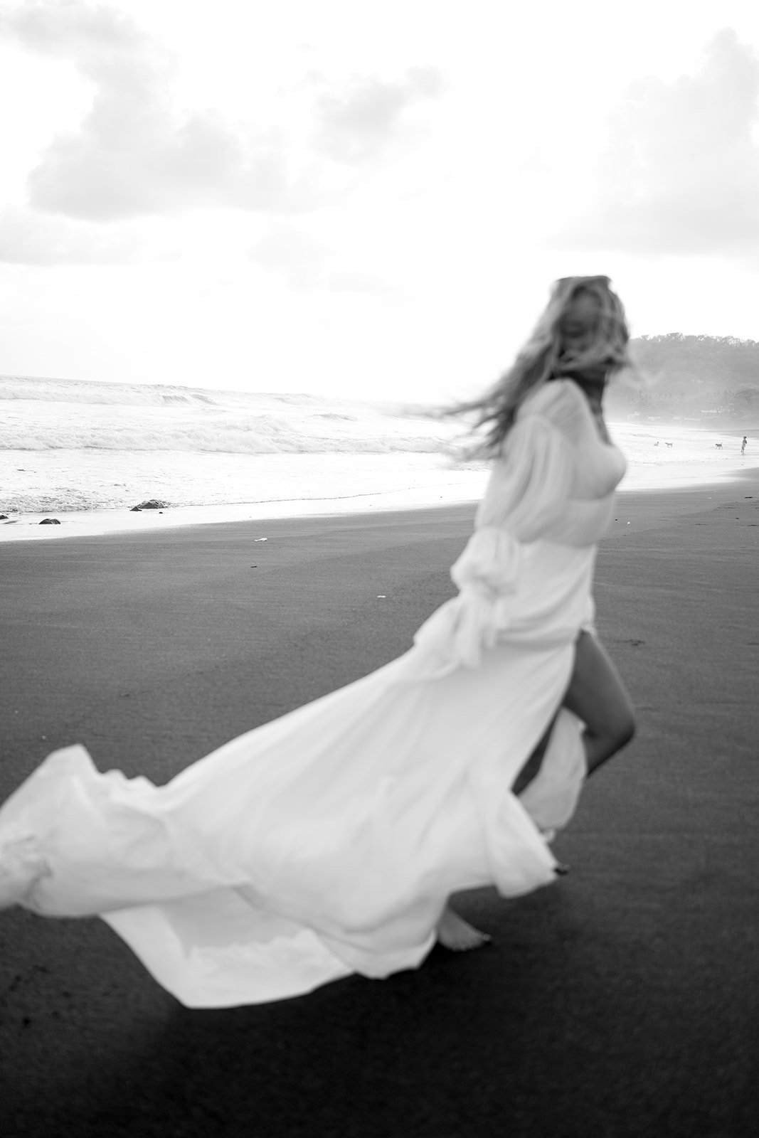 Romantic square neck wedding dress with puff sleeves, open back, and flowing chiffon A-line skirt. Akmaral Bridal