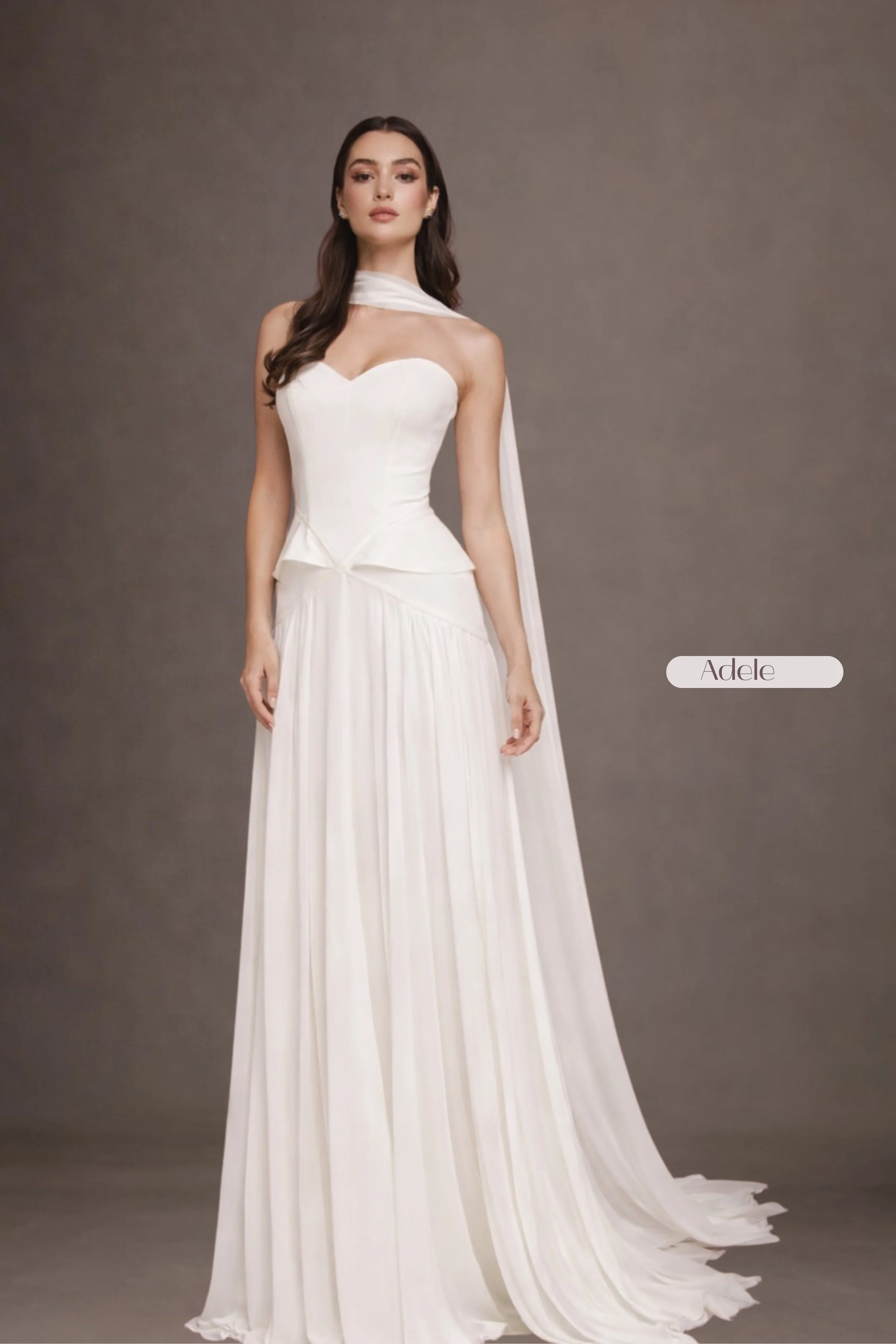 Strapless sweetheart corset dress with crepe bodice, lace-up back, flowing chiffon A-line skirt, and matching chiffon neck shawl. Akmaral Bridal
