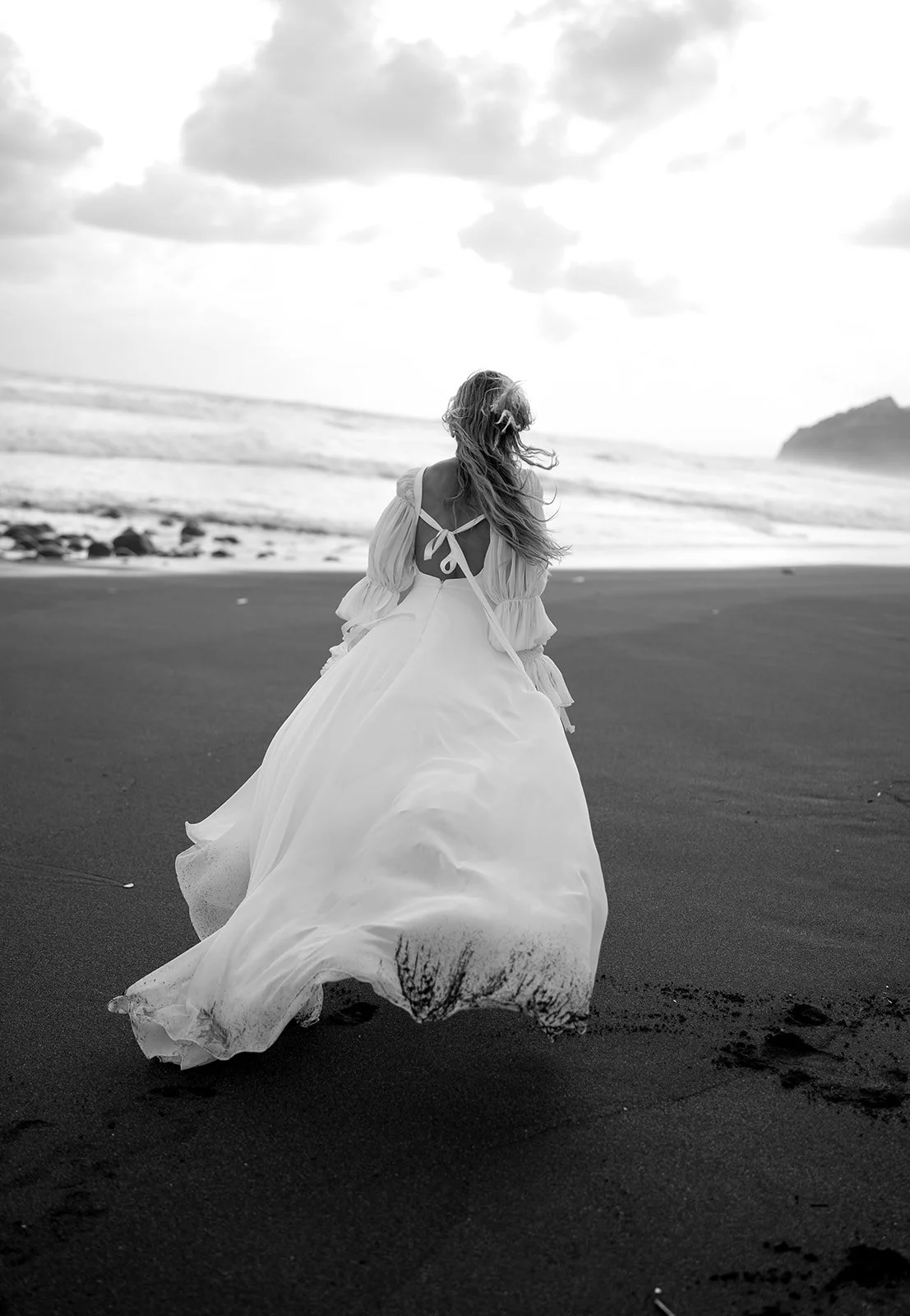 Romantic square neck wedding dress with puff sleeves, open back, and flowing chiffon A-line skirt. Akmaral Bridal