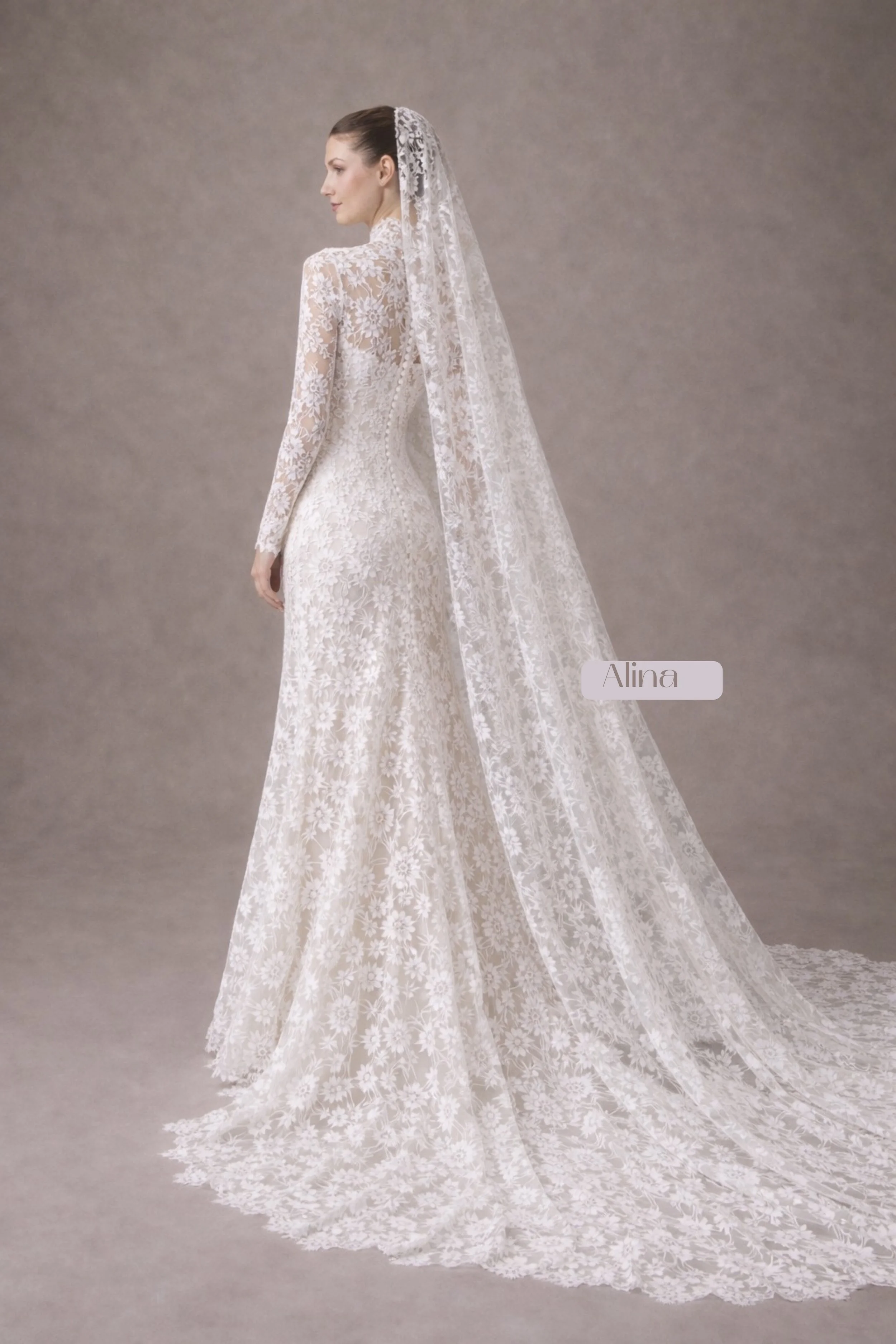 Long sleeve lace mermaid wedding dress with high neckline and dramatic lace train