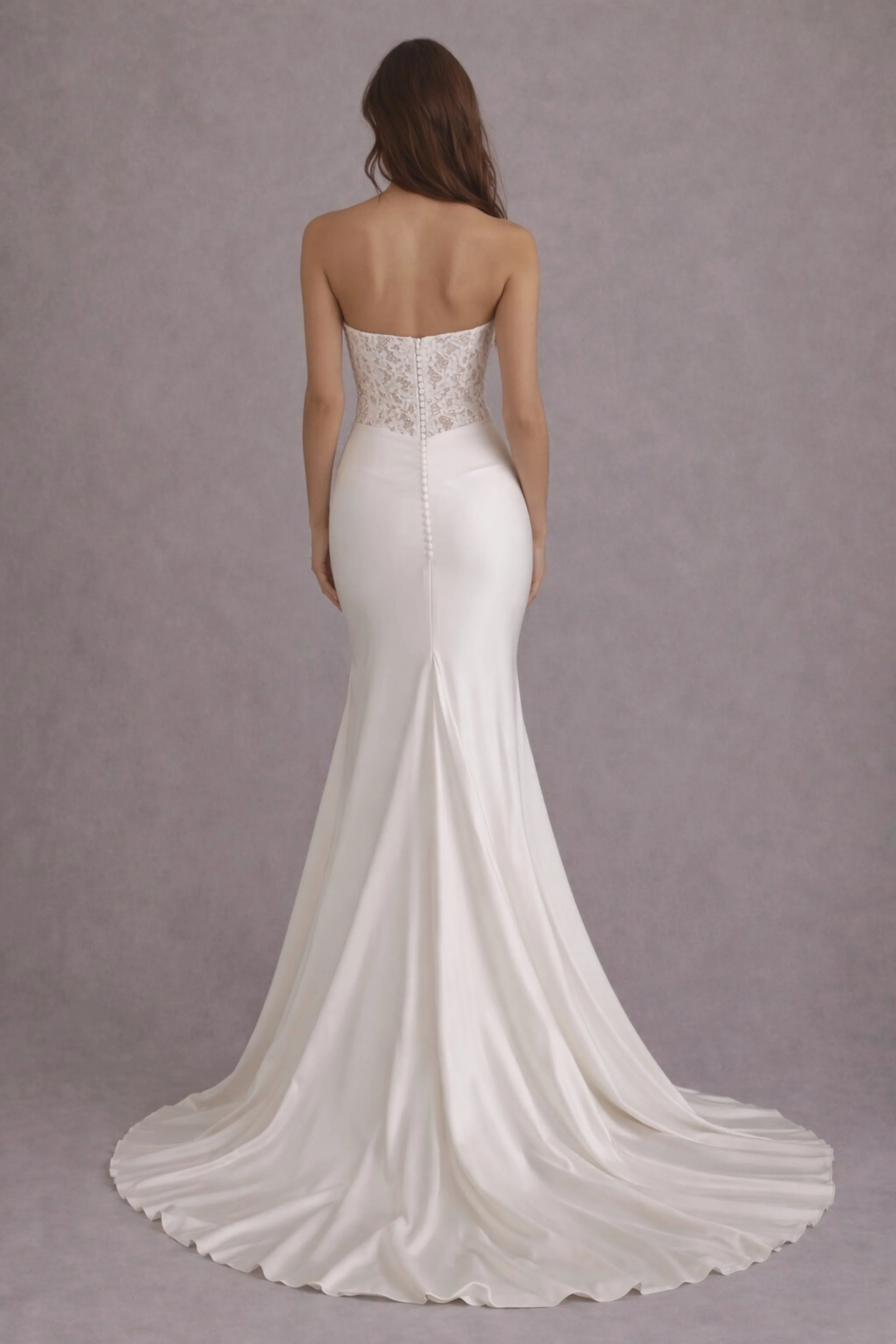 Strapless lace bodice mermaid satin wedding dress with buttons and elegant flowing train back view