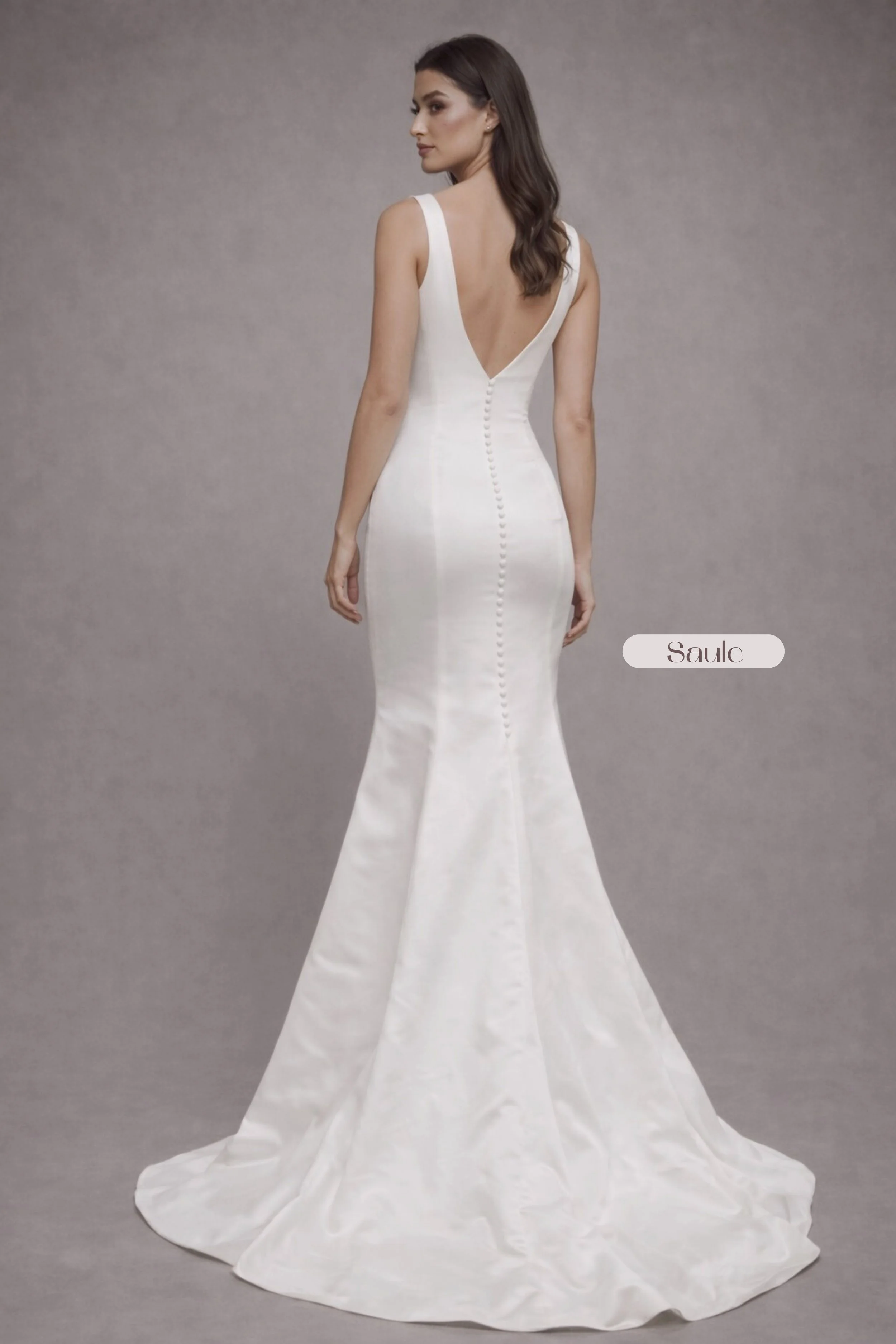 Minimalist silk satin mermaid wedding dress with V-neckline and elegant chapel train