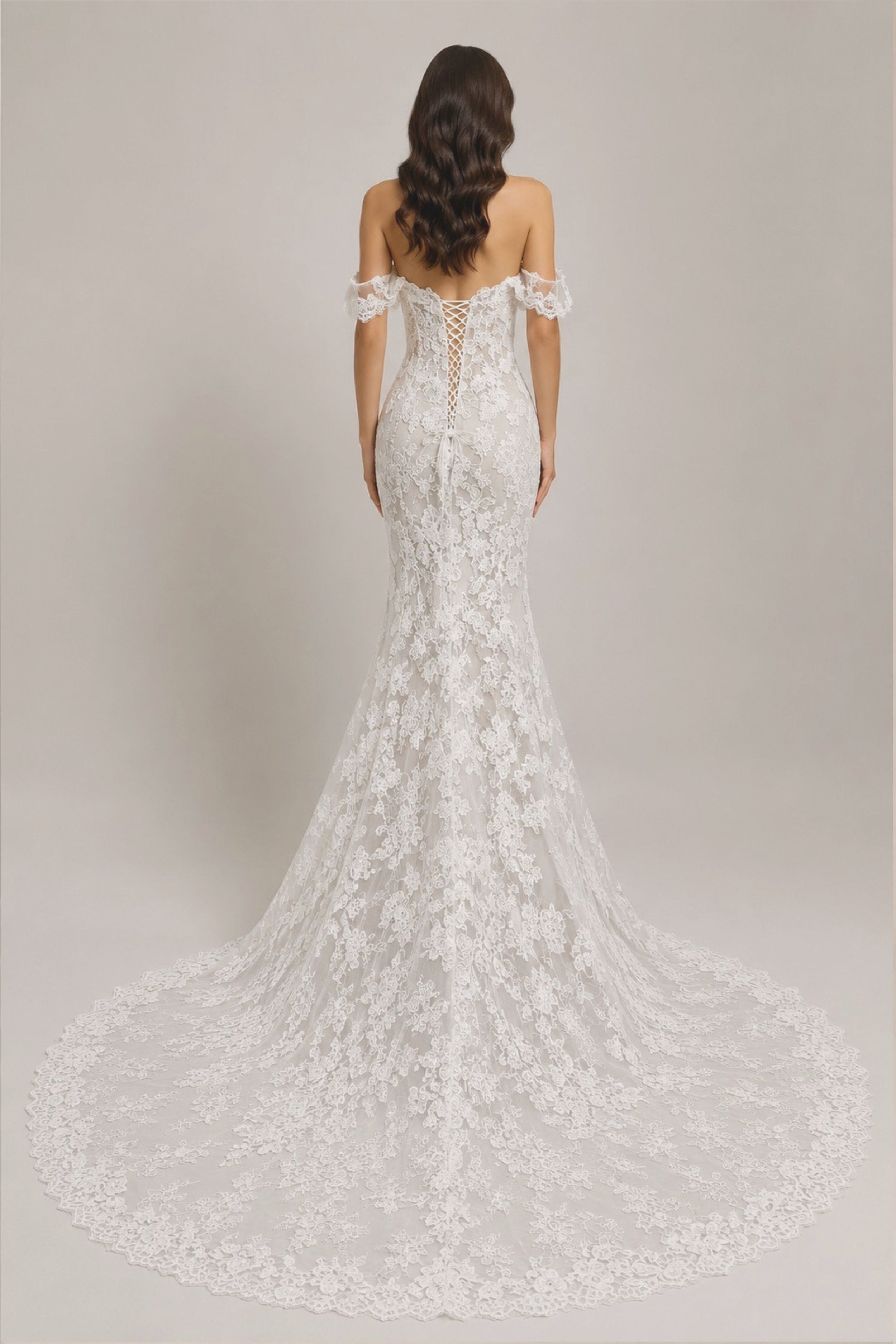 Off-the-shoulder lace mermaid wedding dress with floral appliqué, sweetheart neckline, fitted silhouette, and lace cathedral train.