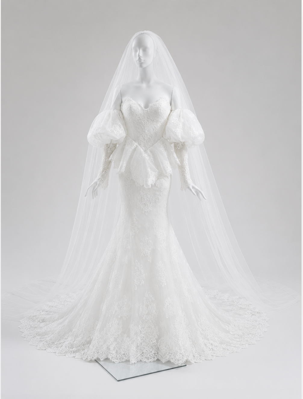 Vintage Chantilly lace wedding dress with sweetheart neckline, puff sleeves, fitted mermaid silhouette and scalloped train for a modern bride.