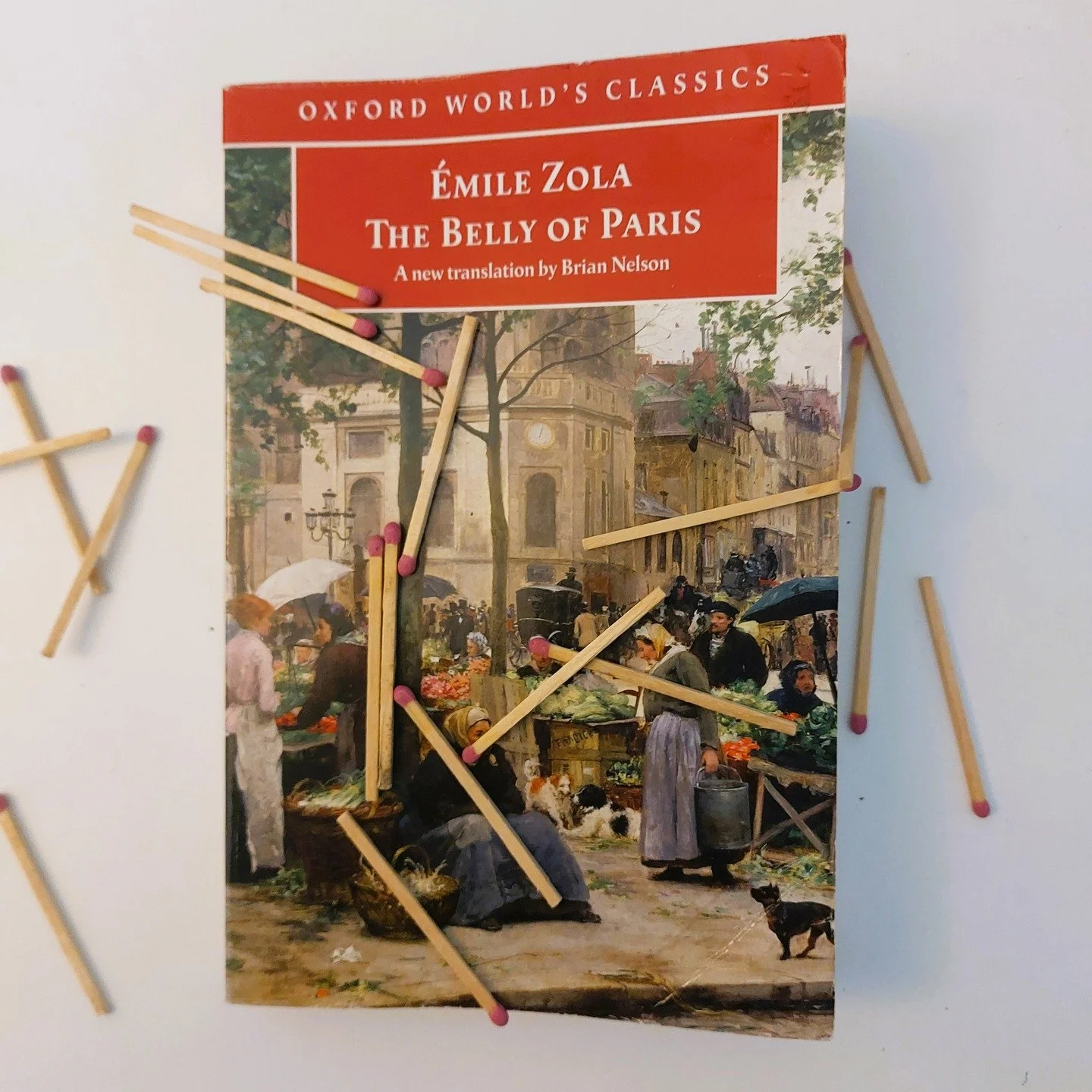 The Belly of Paris by Emile Zola

&quot;All around them the cheeses were stinking...a livarot was swarming with life; and behind the scales a gerome flavoured with aniseed gave off such a pestilential smell that all around it flies had dropped dead o