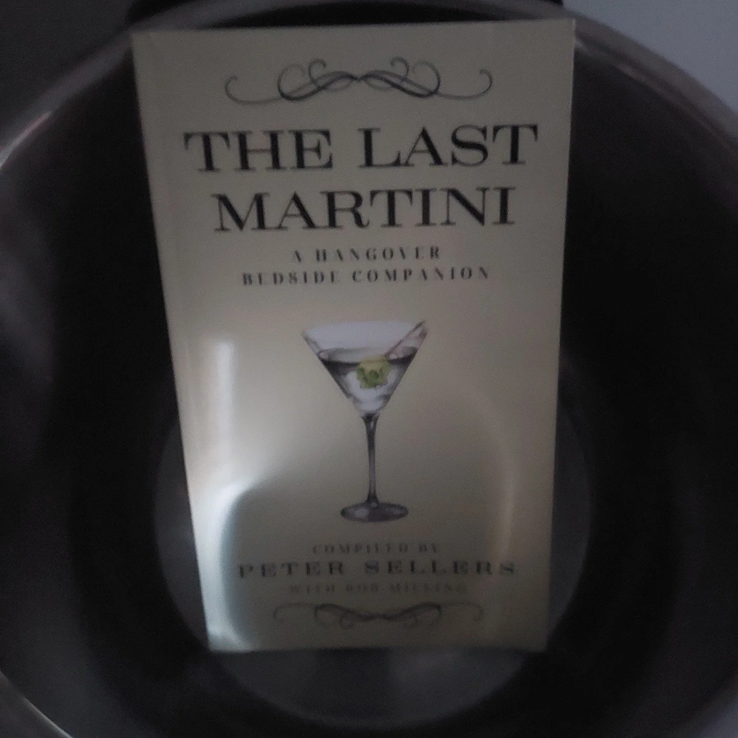 The Last Martini: a Hangover Bedside Companion compiled by Peter Sellers

"If you would drink this, sir," he said with a kind of bedside manner, rather like the royal doctor shooting the bracer into the sick prince. It's a little preparatio