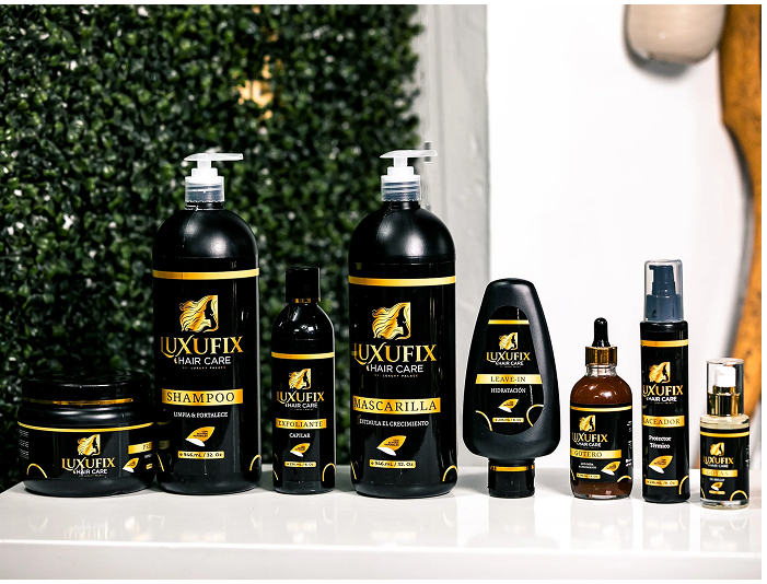 Collection of Lux Ufix hair care bottles and jars, including shampoo, mascarilla, leave-in, and styling products on a white surface.