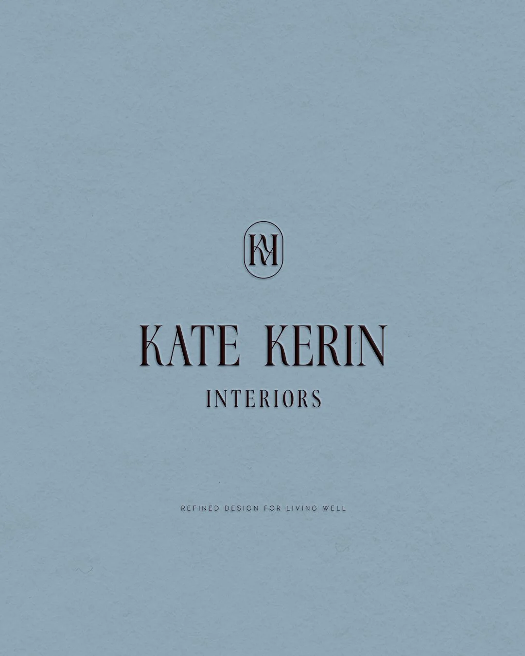 Kate's embossed logo with intertwining Ks and duck egg blue background