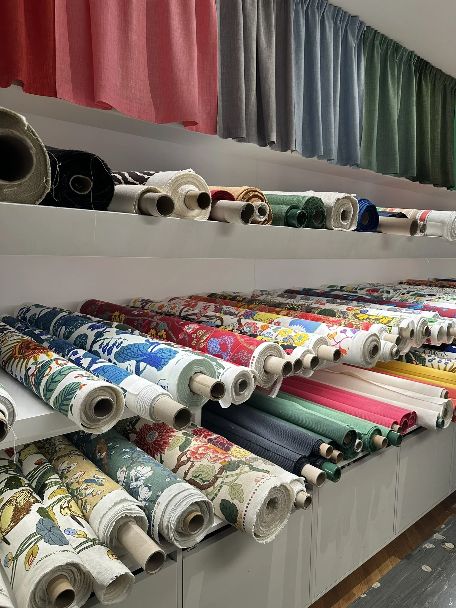 Rolls of beautiful fabric in a Stockholm showroom