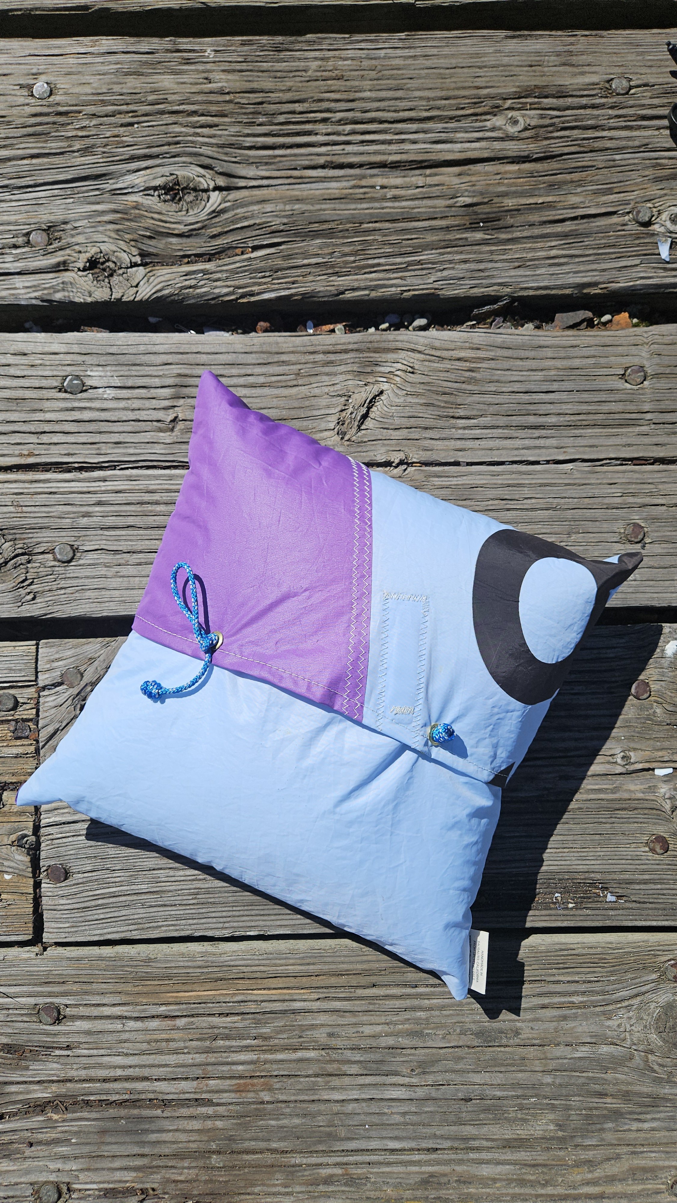 Colorful outdoor patio throw pillow made from recycled sailcloth with numbers and stitch patterns