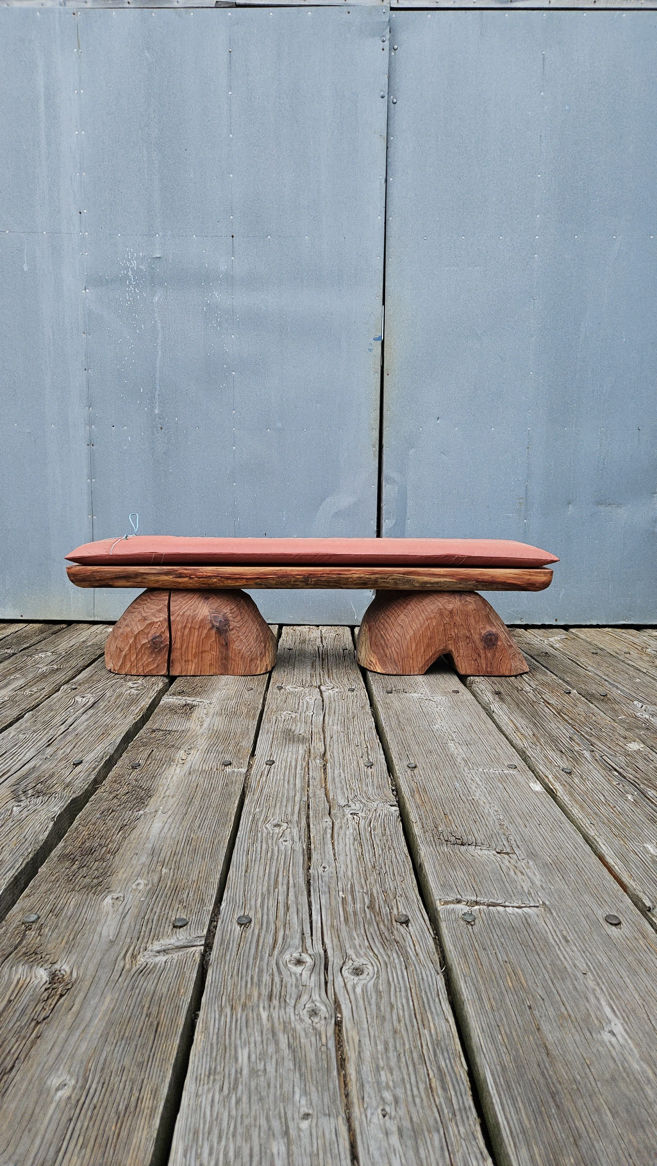 Handcrafted salvaged redwood bench with sailcloth cushion