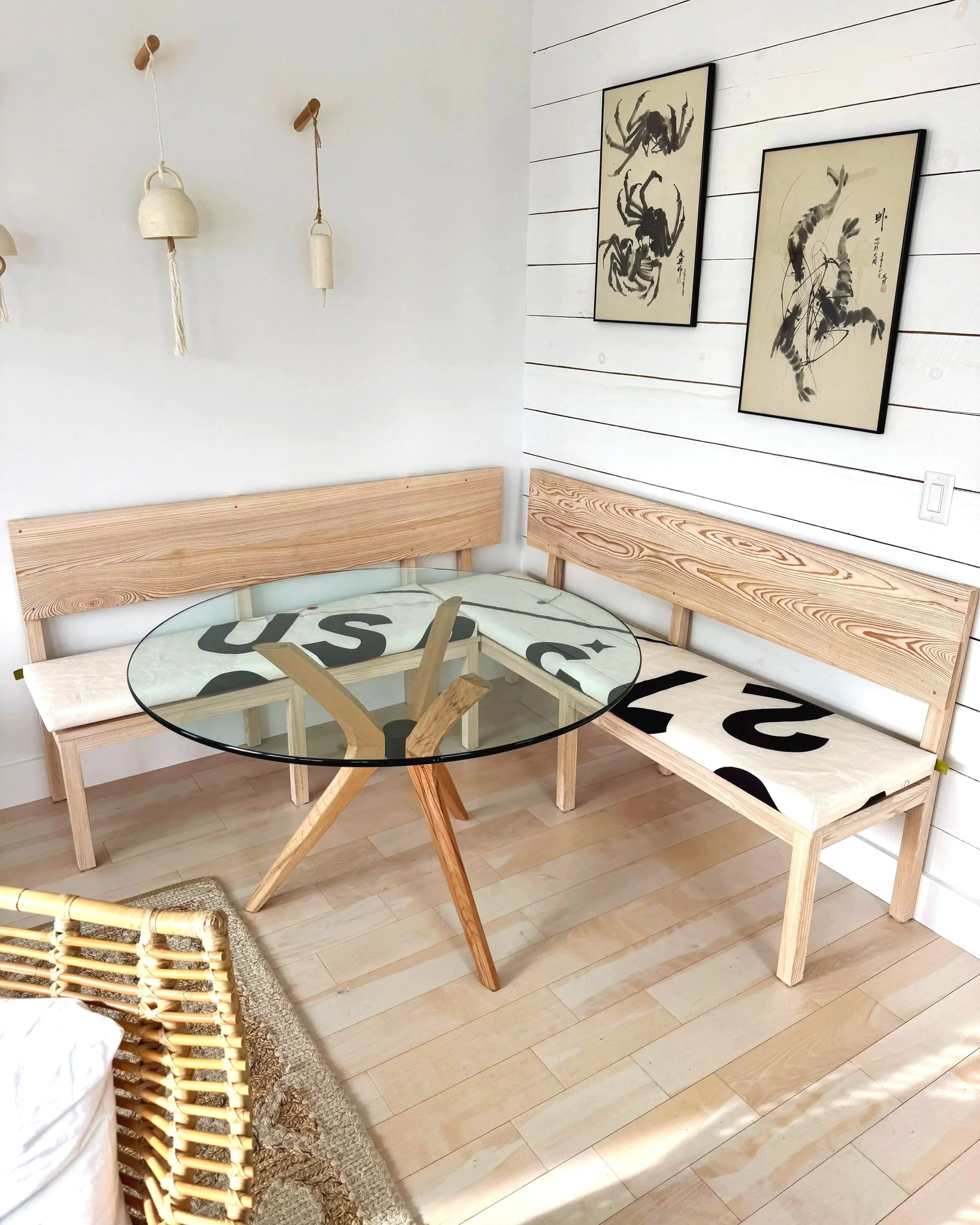 Black and white sailcloth cushions banquette seating beach house decor