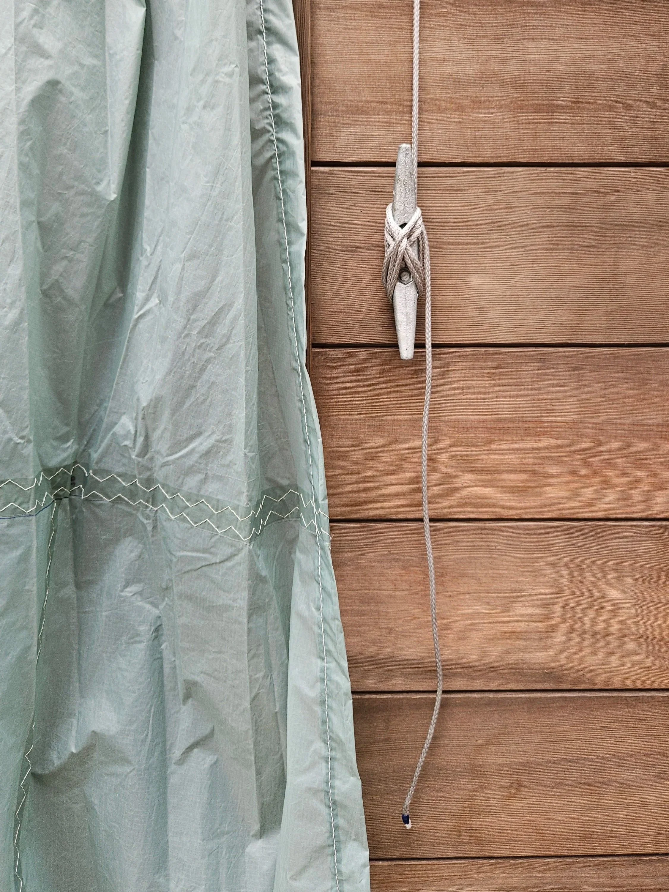Nautical cleat curtain attachment.