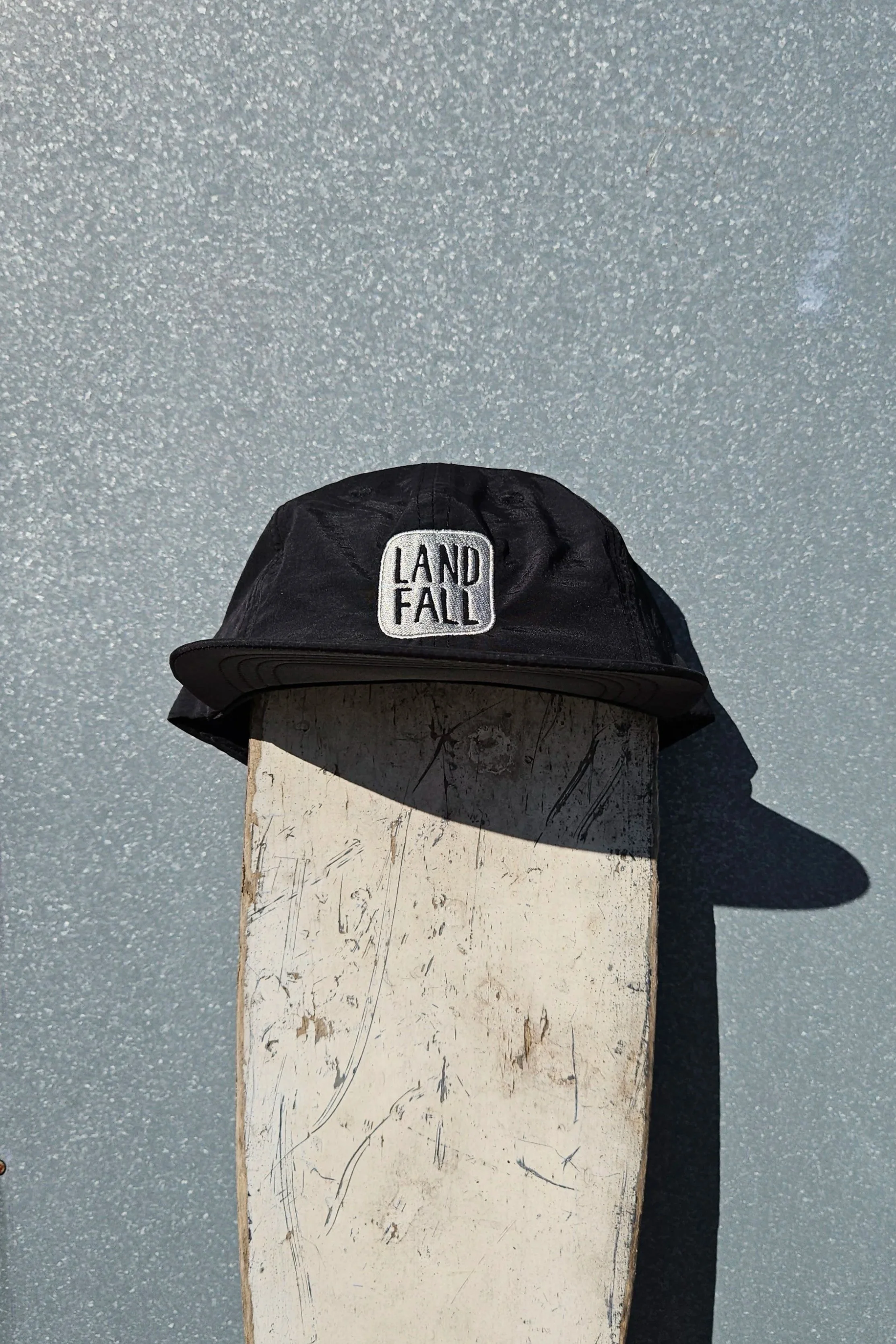 black nylon hat with grey embroidered Landfall logo