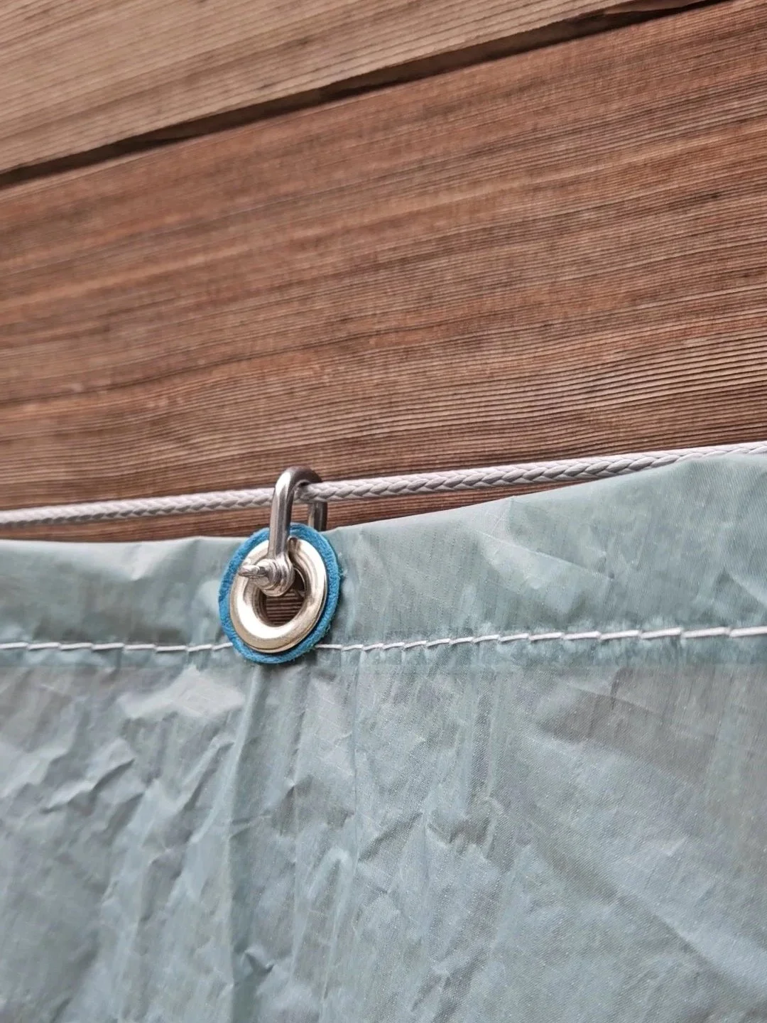 Stainless shackle and grommet curtain system.