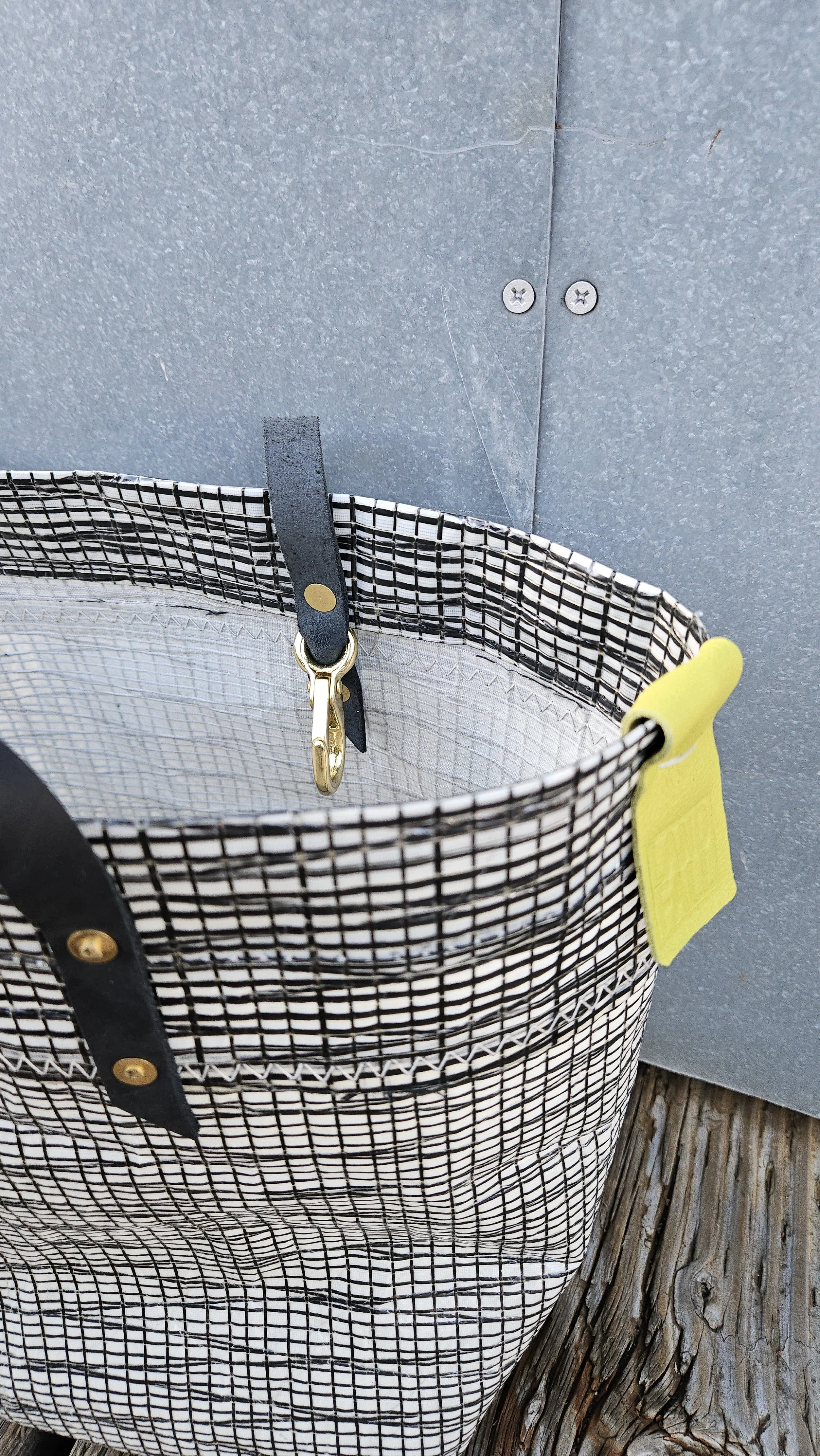 Black and white recycled sail cloth tote bag with brass key clip