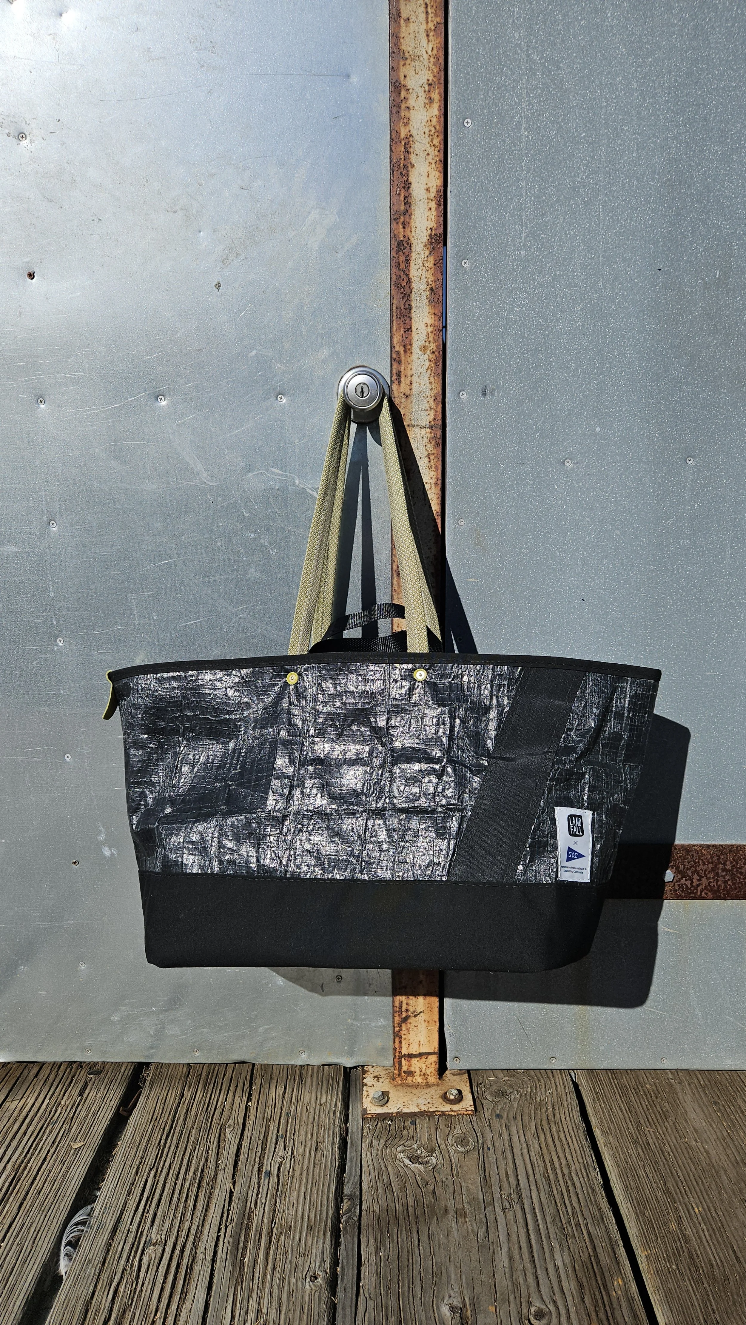 black sailcloth beach tote bag with green rope handles