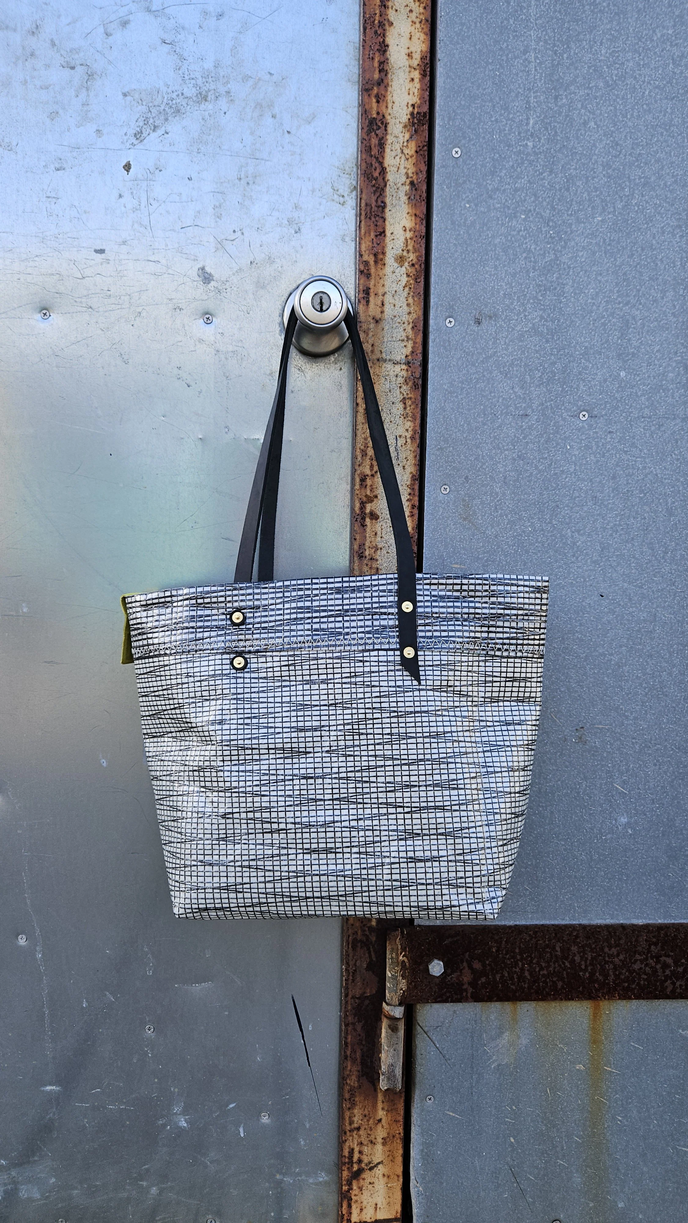 Upcycled sail and leather tote bag