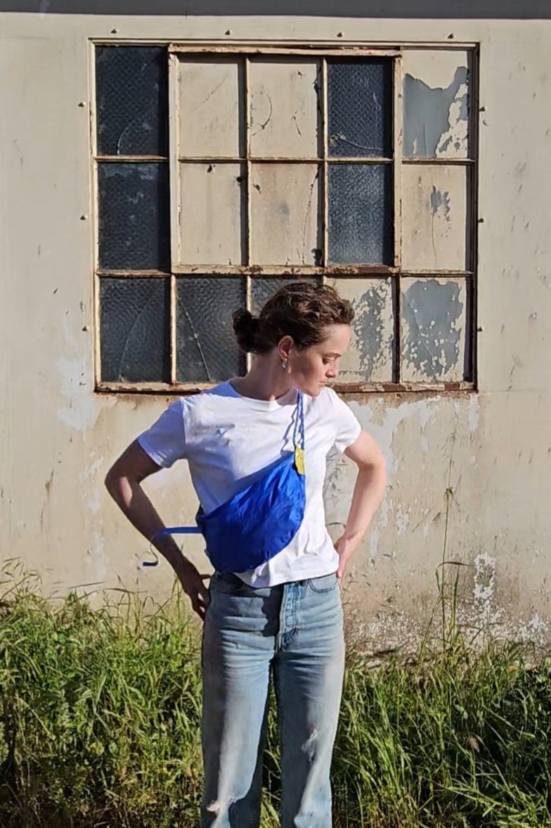 half-moon shaped sling crossbody purse made from upcycled sailcloth