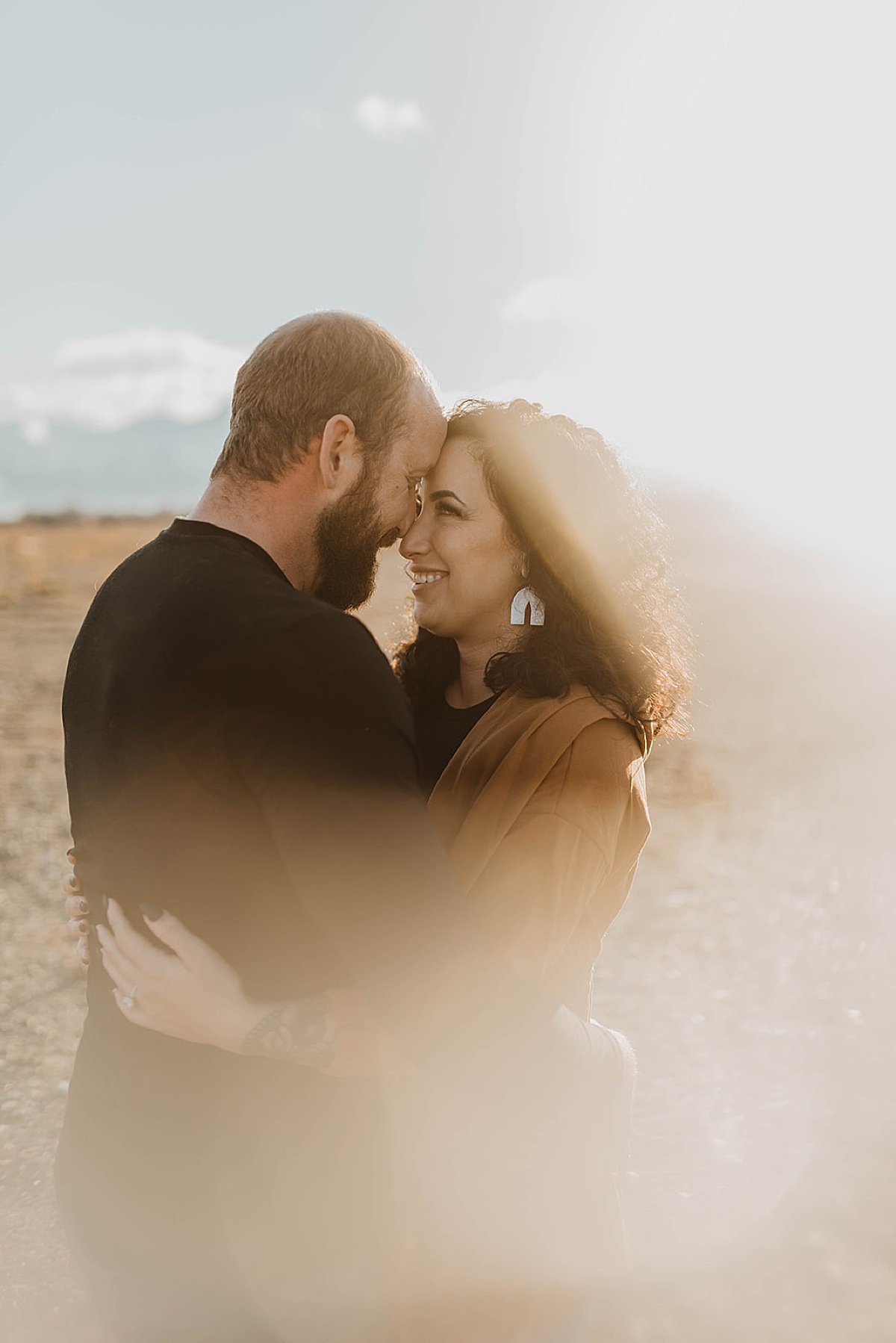  dreamy view of engaged couple embracing during photoshoot by Theresa McDonald Photography 
