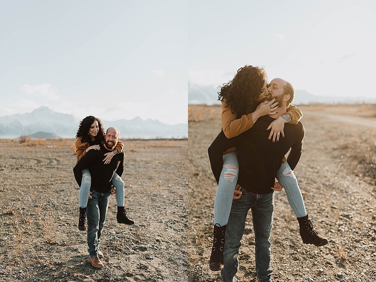  Man gives his fiancee a piggy back ride in outdoorsy engagement shoot by Theresa McDonald Photography 