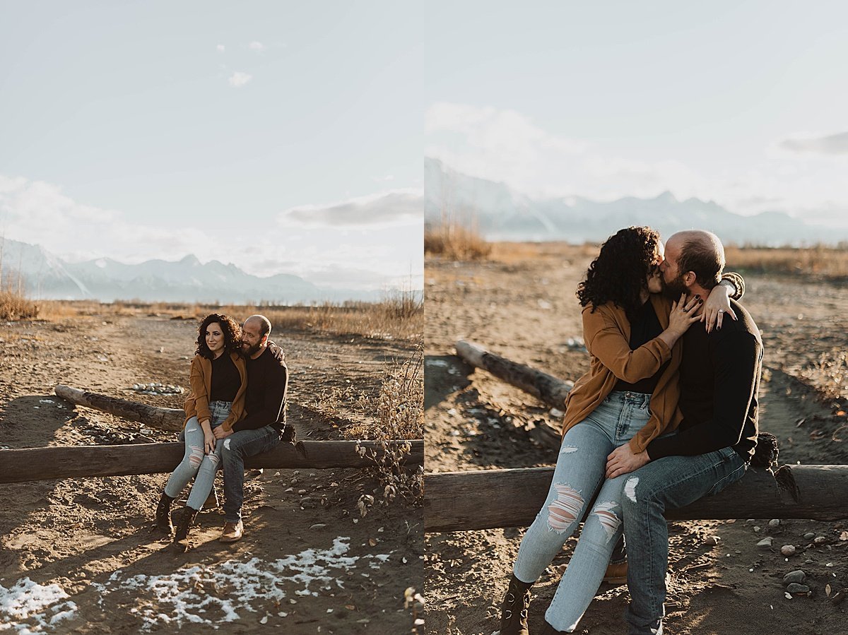  Outdoorsy couple pose on fallen log in engagement shoot by Alaska wedding photographer 